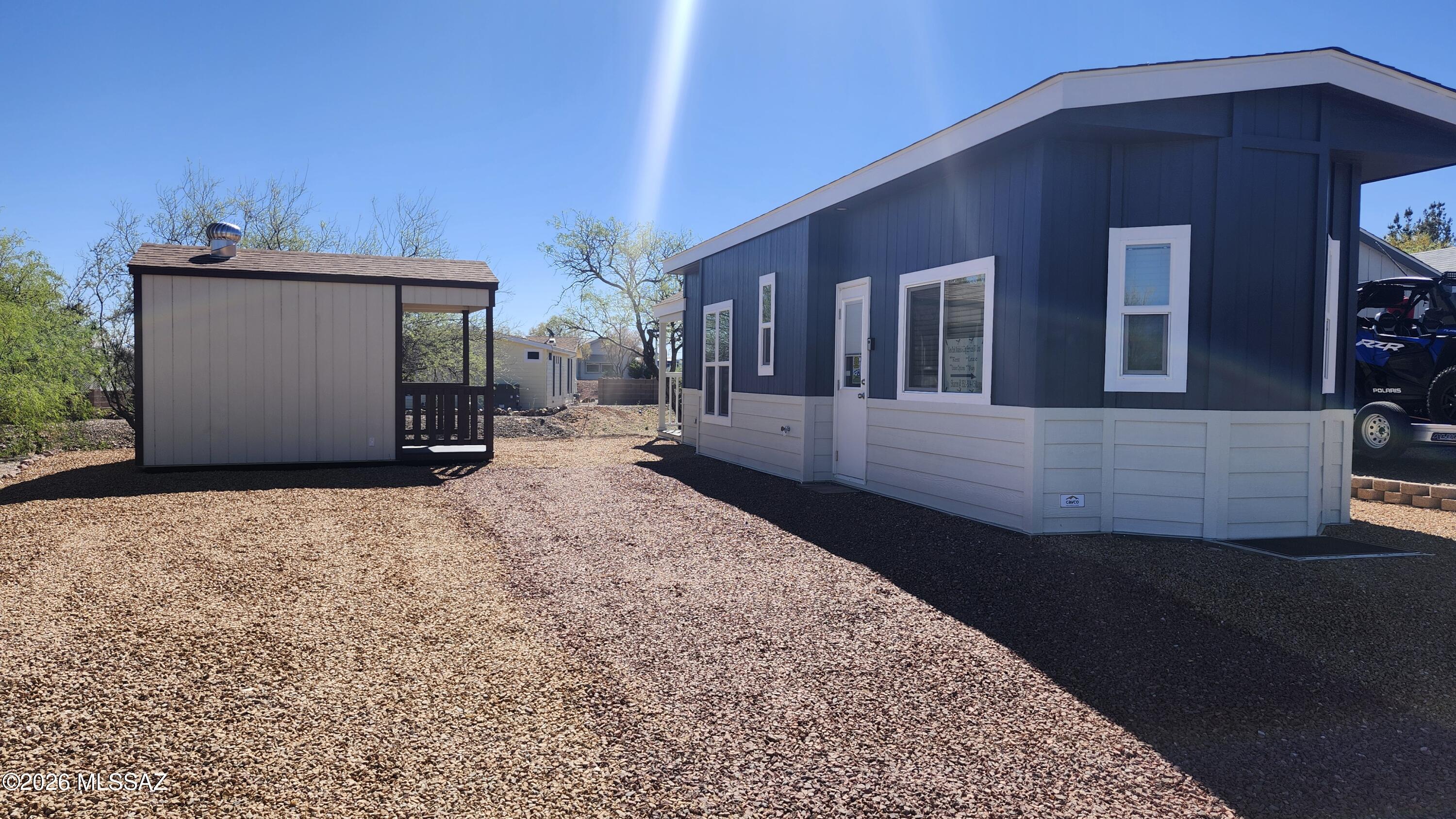 This 2026 Cavco Park Model comes furnished and a rear porch overlooking the natural wash. An 8 x 12 storage shed for those things you want to leave here rather than taking them home. 
You can purchase the home for the list price or purcahse at a reduce rate and lease the lot from the builder.