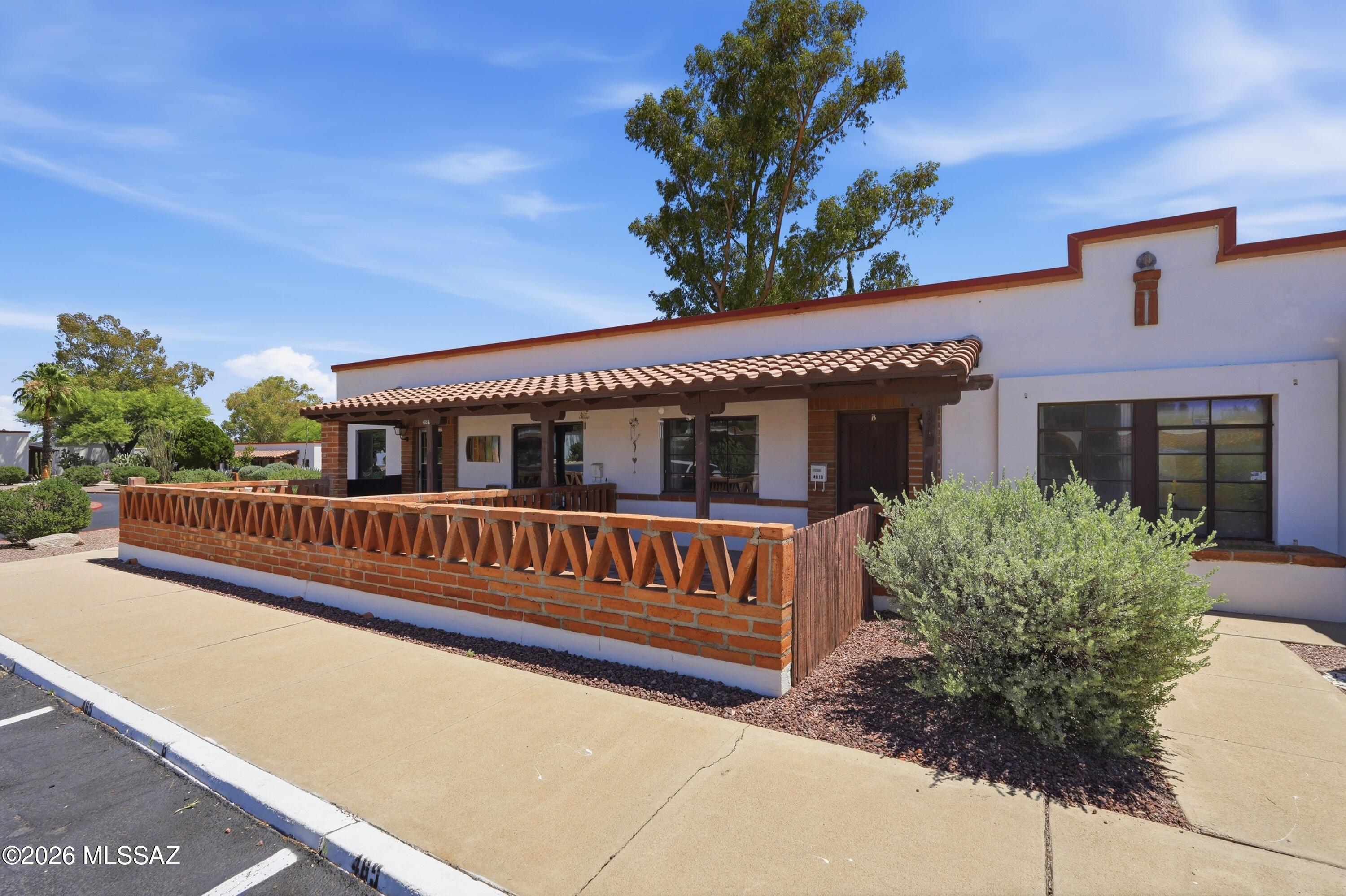 This NO GVR charming and light-filled villa features classic Saltillo tile throughout, creating warmth and timeless Southwest character. Abundant natural light enhances the inviting interior, while the home's quiet location offers a peaceful retreat. Enjoy the convenience of a nearby laundry facility just across the street and easy access to the community pool--perfect for cooling off on warm days. Start your mornings on the west-facing patio, savoring coffee while taking in serene park views and beautiful sunsets. The HOA provides exceptional value, covering exterior building and common area maintenance, exterior pest control, water, sewer, and trash as well as roof, HVAC,and  water heater repair and replacement--allowing for truly low-maintenance living.