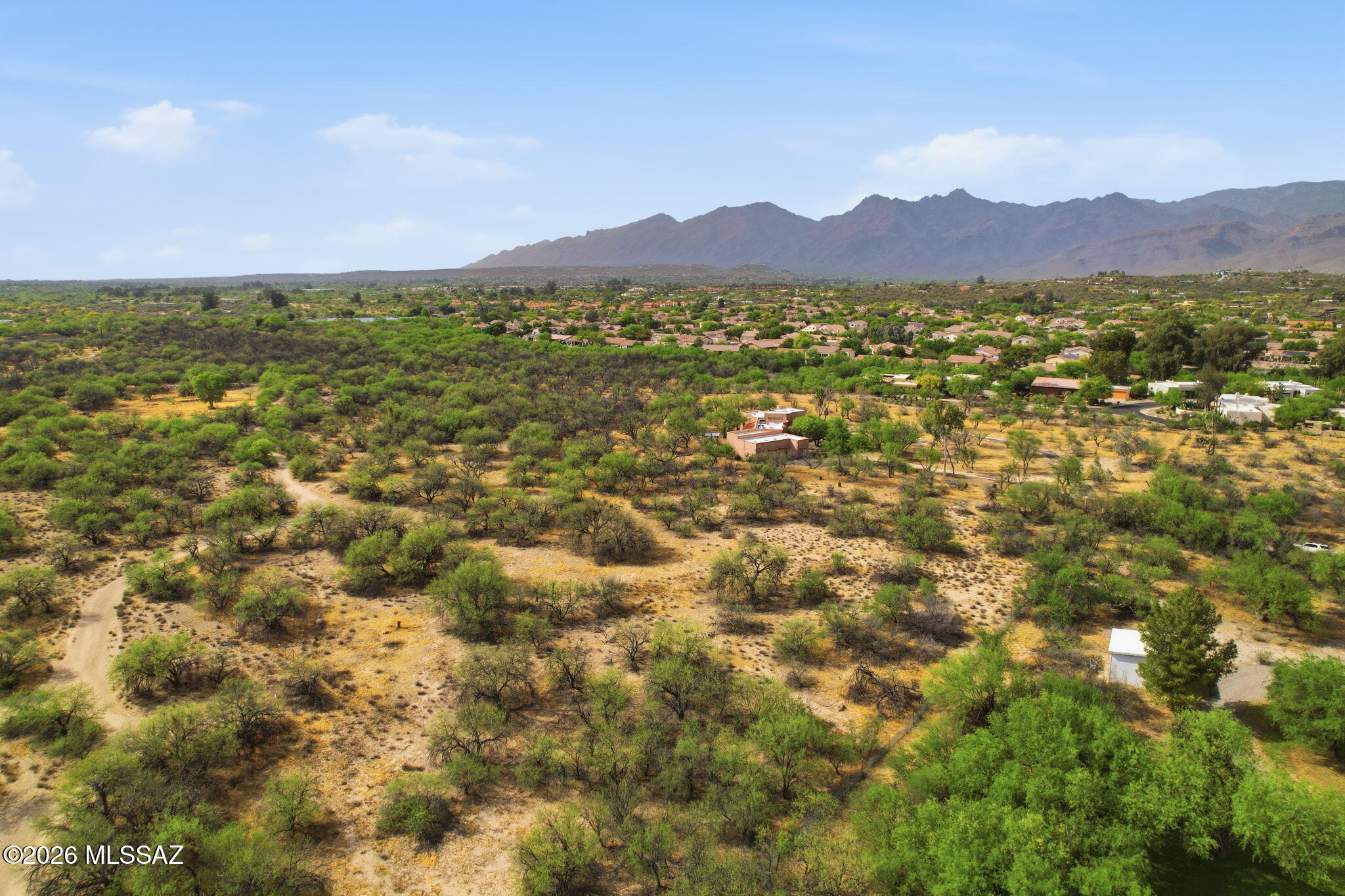 Located in the highly sought-after Bear Canyon enclave, this pristine parcel of 3.51 acres offers a rare opportunity to own a piece of natural Sonoran beauty. This parcel is a child listing and is being sold exclusively in conjunction with the adjacent luxury estate at 1985 N Bonanza Ave (Casa Stella), bringing the total property size to 7 acres. Surrounded by mature mesquite trees and offering ultimate privacy, this lot provides incredible flexibility for the future owner. It serves as the perfect canvas to build a secondary home, create a sprawling private compound, develop a full equestrian ranch, or simply hold as a long-term investment. Together with the main estate, this combined offering presents an unmatched opportunity for versatility, privacy, and upscale living in one of Tucson's most tranquil settings. Buyer must verify all information and utilities.