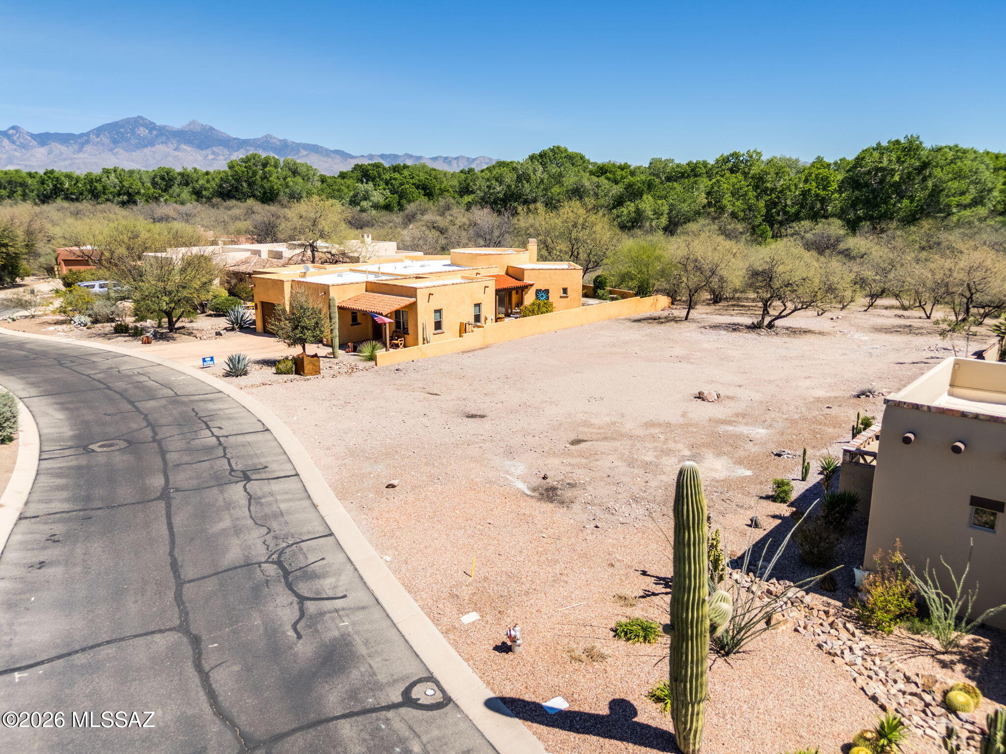 THE LAST OF ITS KIND.  This beautiful property is the only remaining lot in the Barrio that backs on the historic De Anza Trail.  Homes that back on the trail are coveted for their privacy and their access to one of the crown jewels of Tubac.  Over a third of an acre, the level topography and utilities at the lot line make it ready for your dream home to become a reality.  Located just a few minutes from Tubac Village, enjoy the best of Tubac's history, art galleries, shops, restaurants, and more.