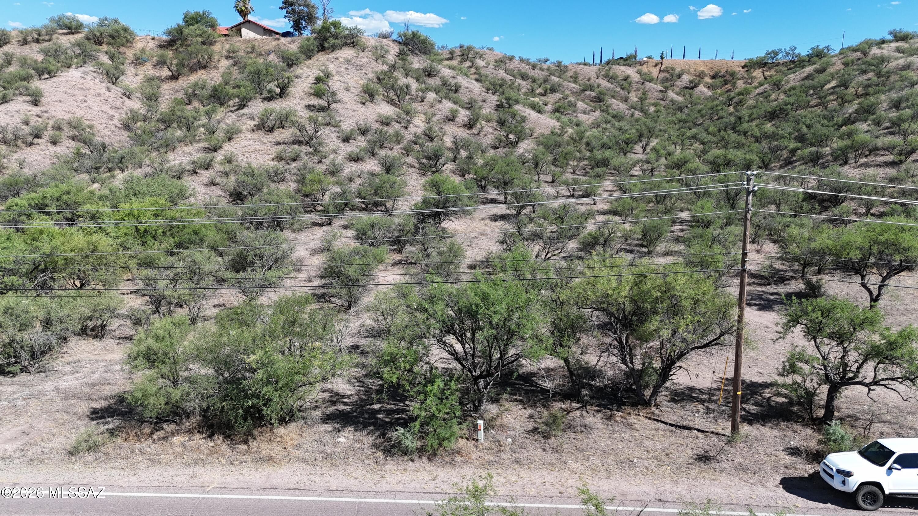 Located close to The Rio Rico Shopping Plaza, will require some dirt work to create a house pad but priced accordingly!  Paved access, electric and water both appear to be at the lot line at the street.  I will upload the water verification from Liberty to the Documents tab when I get it back.