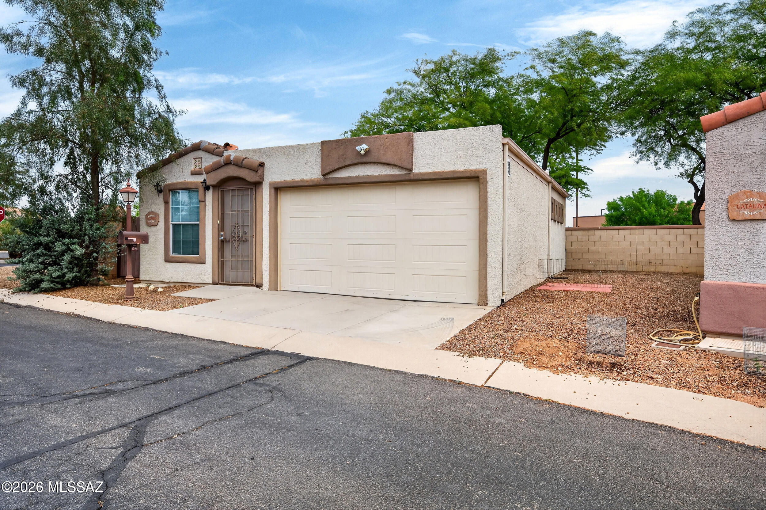 ***SELLER WILL RESPOND TO OFFERS BETWEEN $200K - $210K***Welcome to the Ocotillo Model by CAVCO, originally built as a model home and thoughtfully designed for easy, low-maintenance living in the gated 55+ community of Rancho Resort. This move-in ready home features fresh interior paint, updated flooring, and no carpet throughout. The spacious kitchen offers full-size appliances, plenty of cabinet space, and an open layout that feels comfortable and functional. Both bedrooms are generously sized, and the primary bedroom includes a sliding door with direct access to the backyard patio.  Additional features include built-in hallway cabinets, shelving in the second bedroom, space for a full-size washer and dryer, and an oversized one-car garage with built-in storage cabinets. One of the best features of this home is the location--directly across from the clubhouse, pool, and community amenities. Rancho Resort is known for its welcoming atmosphere, active lifestyle, and beautifully maintained grounds, all conveniently located near shopping, restaurants, and I-10 access.