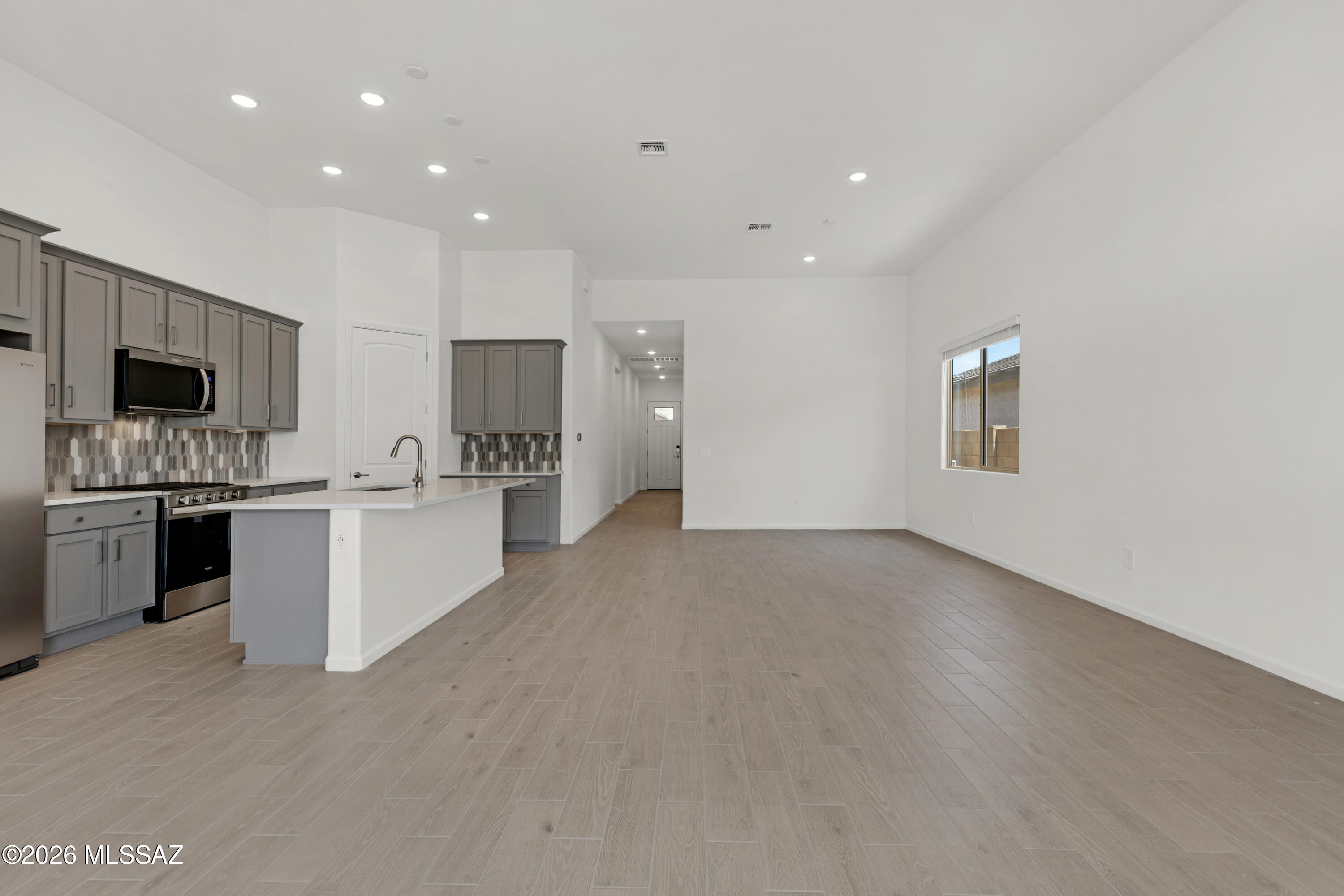 Ginger floorplan with Ranch elevation. Thoughtfully designed home offers 3 bedrooms, 2 full baths and convenient Stop-n-Drop area just off the 3-car tandem garage, making organization a breeze. The Owner's suite is a sanctuary featuring huge walk-in closet, linen closet for extra storage, beautifully tiled walk-in shower & vanity with twin sinks. The kitchen is equipped with a gas range, quartz countertops, 42'' upper cabinets for ample storage, a center island that's perfect for meal preparation and a walk-in pantry for all your culinary essentials. Step outside to the covered patio making outdoor entertaining a delight. Includes Washer/Dryer, Refrigerator & Blinds.