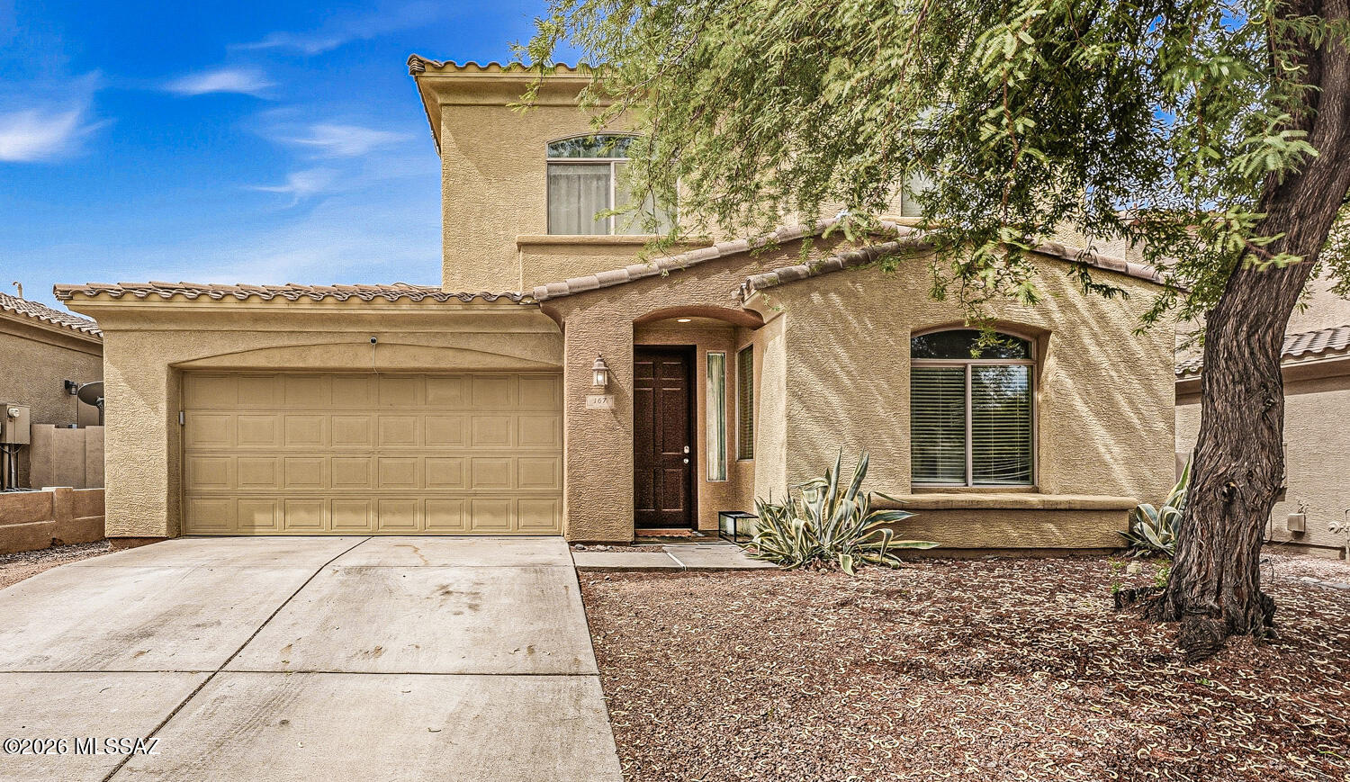 Welcome to your new home in the highly sought-after gated community of Encanto Del Lago in Rancho Sahuarita!

This spacious 3-bedroom, 3-bath home with a versatile den downstairs which can be an office or guest room, offers the perfect blend of comfort, functionality, and location. Designed with both everyday living and entertaining in mind, the thoughtful floor plan features formal living and dining rooms, along with an inviting family room that opens seamlessly to the spacious eat-in kitchen.

The kitchen is the heart of the home, offering abundant cabinetry, a center island with breakfast bar seating, sleek built-in appliances, gorgeous granite and plenty of prep space for gatherings with family and friends. Retreat to the oversized primary suite featuring a large walk-in closet and a spa-inspired en suite bath complete with dual vanities, a relaxing soaking tub, and a separate walk-in shower. The secondary bedrooms share a convenient Jack-and-Jill bathroom, while the downstairs den/room includes its own closet and adjacent bath, making it ideal for guests, a home office, or multigenerational living.

Step outside to your own private backyard retreat featuring a spacious covered patio, a dedicated paver area, and a beautiful koi pond that creates a peaceful, tranquil setting. With its low-maintenance landscaping and relaxing ambiance, this outdoor space is perfect for entertaining guests or simply unwinding at the end of the day.

Living in Rancho Sahuarita means enjoying resort-style amenities, including Club Rancho Sahuarita's water park, pools, fitness center, scenic lake, walking trails, parks, playgrounds, and year-round community events--all included with the HOA. Conveniently located near shopping, dining, schools, and easy access to I-19, this home offers the lifestyle you've been looking for.

Don't miss your opportunity to own this exceptional home in one of Sahuarita's most desirable gated communities!