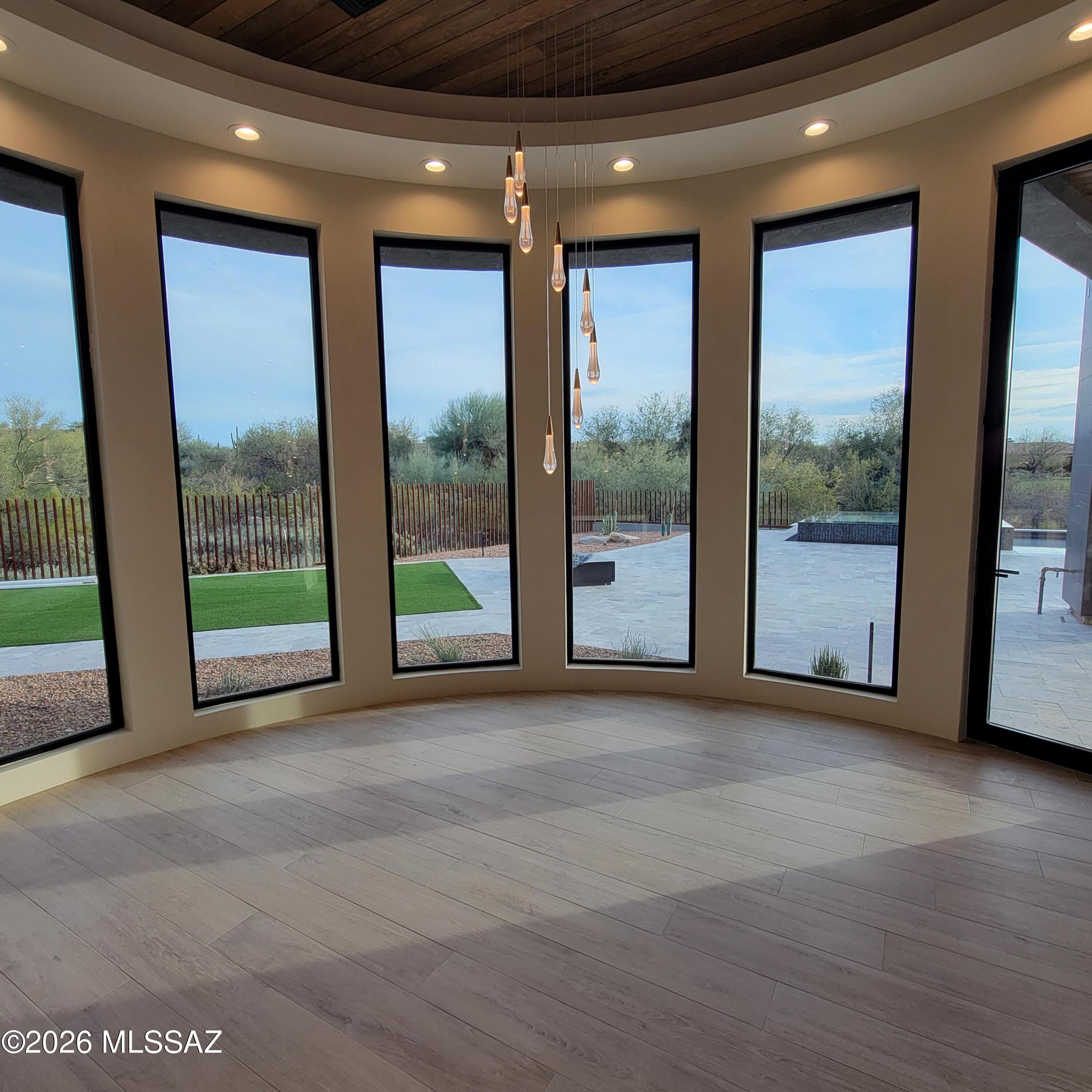 Recently completed new construction overlooking the 17th green of The Gallery North Golf Course, with sweeping views of the Tortolita Mountains from the front of the home.  Thoughtfully designed and impeccably executed, this refined desert modern estate showcases meticulous attention to detail throughout.

The residence offers 4 bedrooms, 4 full bathrooms, and a dedicated office or optional guest bedroom, delivering both functionality and flexibility. A gourmet kitchen anchors the home, featuring Dacor appliances, custom cabinetry, and premium finishes--ideal for both everyday living and elegant entertaining.

Located within the gated Gallery Community, this home combines privacy, architectural excellence, and a premier golf course setting, all just