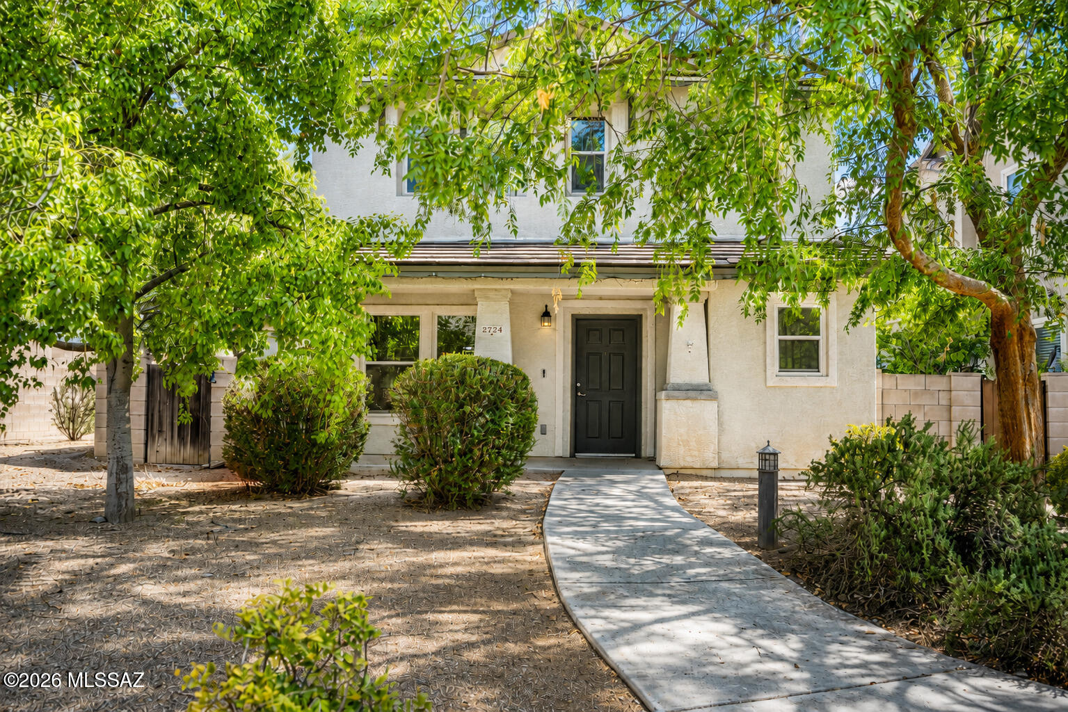 Tucked at the quiet end of a Midtown cul-de-sac, this two-story, three-bedroom, three-bath home offers 1,817 square feet wrapped in lush, mature landscaping. The main floor's open layout flows from a great room into a dining area and a bright kitchen with sleek quartz countertops, all set atop brand-new laminate flooring. Upstairs, two guest rooms share a full bath, while the extra-large primary retreat boasts a double vanity, soaking tub, separate shower, and walk-in closet. Location spoils you: Fort Lowell Park sits steps away, with Tucson Medical Center, shopping, and acclaimed University High School close by. Move-in ready and thoughtfully updated--come see it before someone else calls it home!