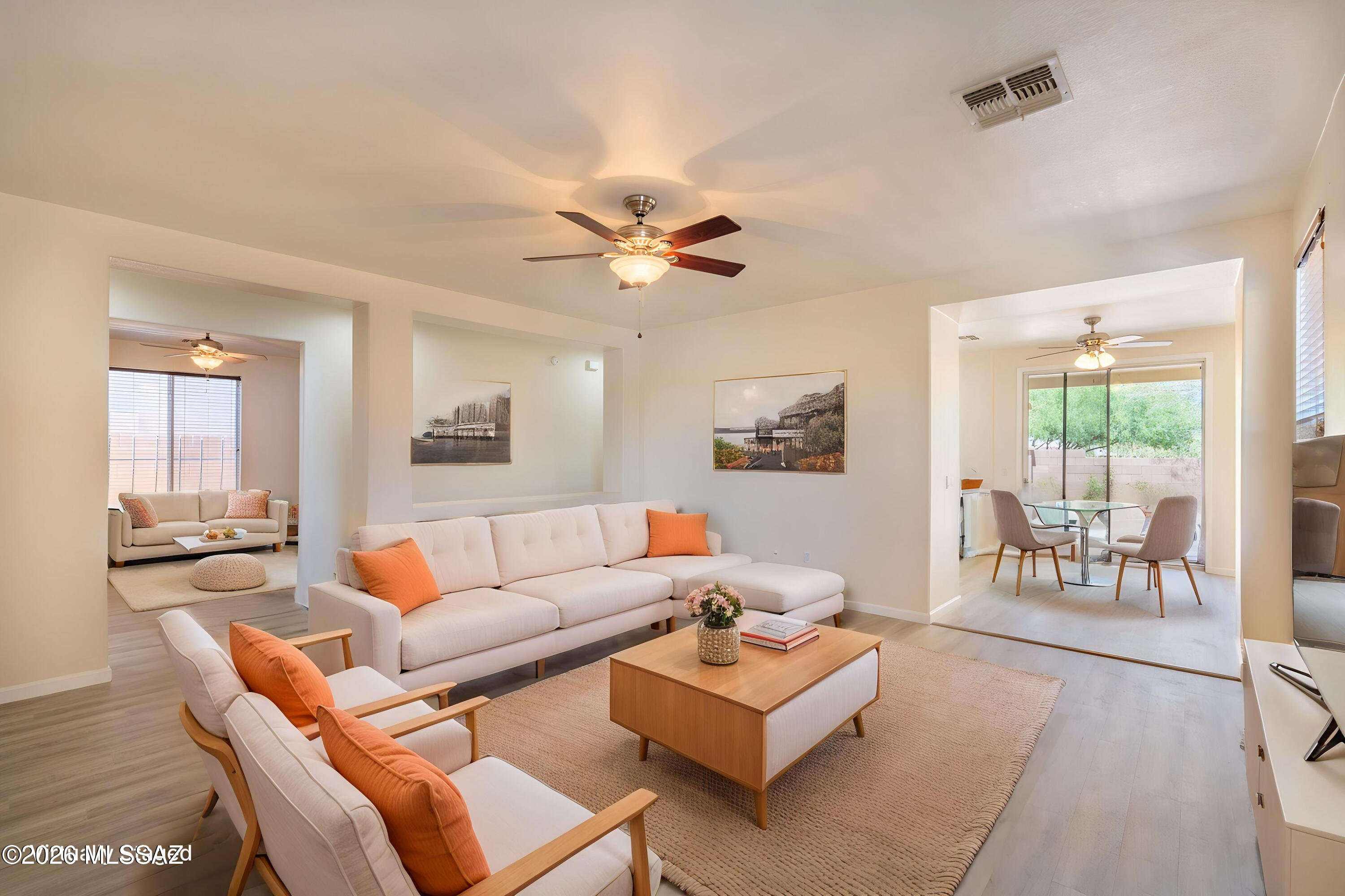 Discover resort-style living in Rancho Sahuarita, ideally located near the lake, clubhouse, and shopping. This updated home features a gourmet kitchen with double ovens and refinished cabinets, plus luxury plank vinyl flooring throughout and new carpet in the bedrooms. The spacious primary suite offers a deluxe bath with soaking tub and separate shower. Enjoy fresh interior paint, recently painted exterior, and updated plumbing fixtures. Offering 3 bedrooms plus a den, 2 baths with refinished vanities, and a large backyard with mature rose bushes and lush landscaping--this move-in ready home has it all.
