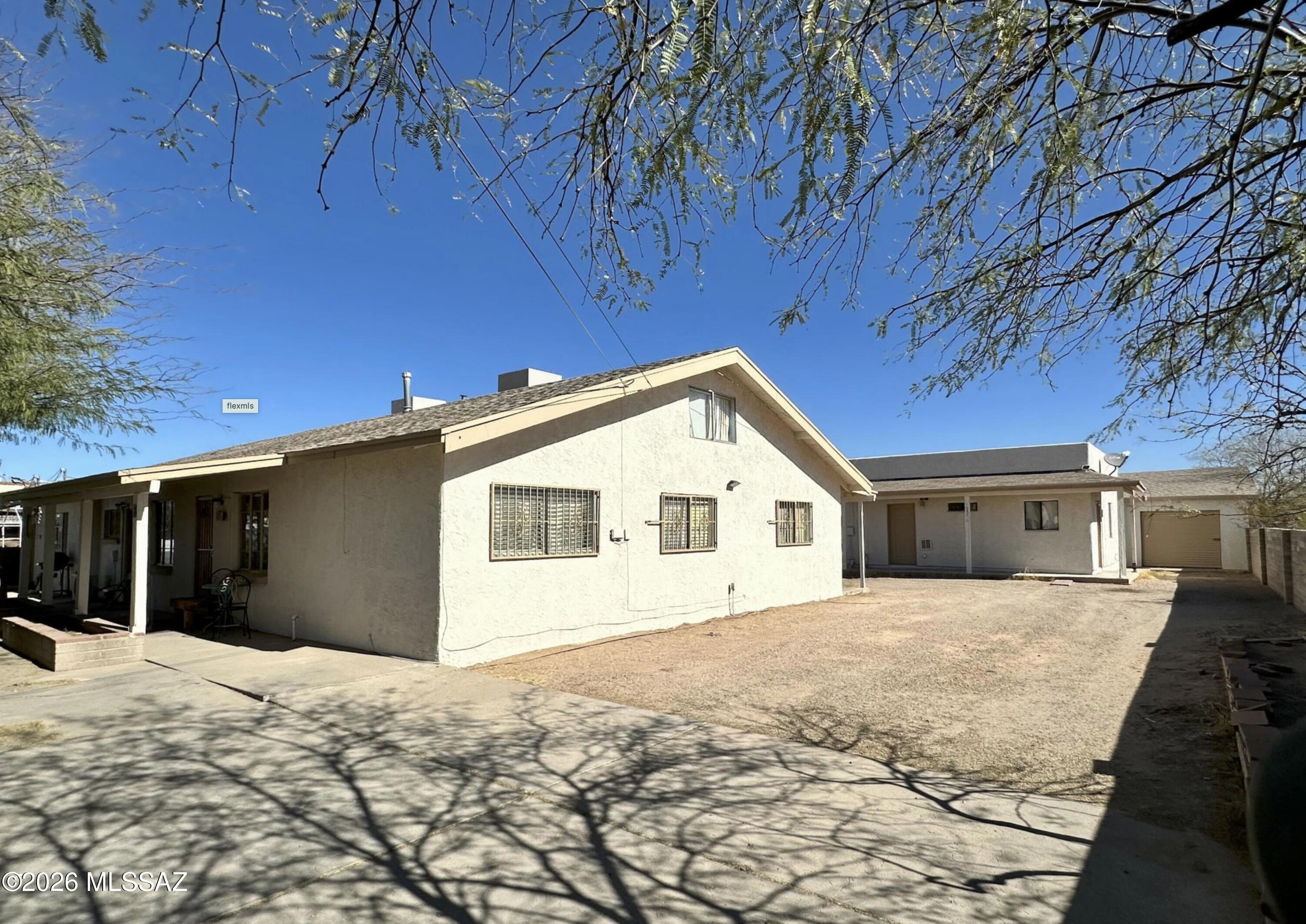 Discover this spacious single-family home featuring a detached Casita! The main house includes three versatile units ideal for an office, art studio, guest suite, workout area or multi-generational living. Perfect opportunity for flexible living arrangements and endless possibilities! Unit A 1375ft.² 3/2 w/large loft. Unit B 1057ft.² 2/2 w/large loft. Unit C 600ft.² 1/1 Detached casita with laundry. Unit D 225ft.² studio. 3 storage units 8x8x9high & back storage/garage 18X14. Main home 594 ft.² built 1969. Additions in 1981 & 1985 5/4 & studio. 2063ft.².Casita: 1/1 2000 built 600ft.². Loft area: 400ft.²x2 (not included in total ft.²). Plenty of parking on this .34 acre lot w/ perimeter Block wall & exterior recently painted. Tucson destination area for Gem Show,  New Mosaic Iceplex, Kino Sports Plex, Tucson Rodeo, Sports competitions, Shopping, Restaurants, VA Hospital & Entertainment Galore. With the right business plan the right opportunity knocks..