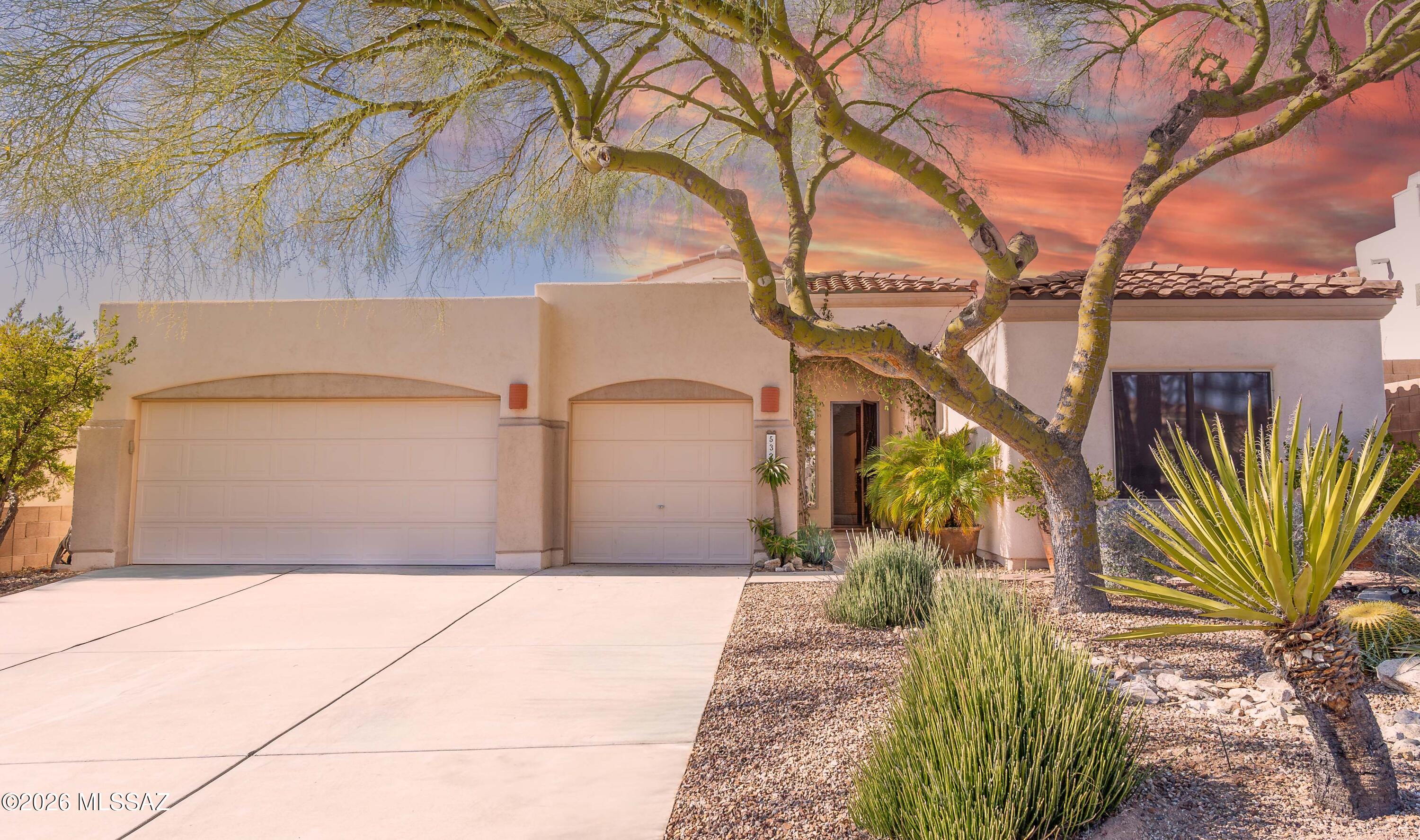 Stunning mountain views surround this beautifully maintained 4-bedroom, 3-bathroom, single-story home with a 3-car garage, located in the highly desirable, gated community of Sabino Springs.  Appreciate the open, inviting floorplan, high ceilings, and comfortable living space centered around a cozy fireplace. Oversized sliding glass doors fill the home with natural light and seamlessly connect the interior to a private backyard oasis, designed for relaxation and entertaining, featuring a heated saltwater pool and hot tub, low-maintenance desert landscaping, and breathtaking views of the Santa Catalina Mountains.  The renovated kitchen is a chef's dream, offering abundant countertop space, a large island, breakfast bar, 42'' custom Alder cabinetry, and stainless-steel appliances--perfect for both everyday living and hosting guests.  The home features a split floorplan, providing privacy for the spacious primary suite, which includes a generous bathroom with double vanities, a separate soaking tub and shower, a large walk-in closet, and a private toilet room. Plantation shutters throughout the home add elegance while allowing ample natural light.  Recent upgrades include a newer HVAC system and a roof replaced in 2023. Additional highlights include built-in storage cabinets in the oversized garage, a water softener, newer drip irrigation, and all appliances convey, including refrigerator, washer, and dryer.  In the community, enjoy amenities including a pool and spa, fitness facility, scenic walking paths, and a public golf course and restaurant within walking distance.  This home combines comfort, quality upgrades, and spectacular surroundingsan exceptional opportunity to enjoy the Sabino Springs lifestyle.