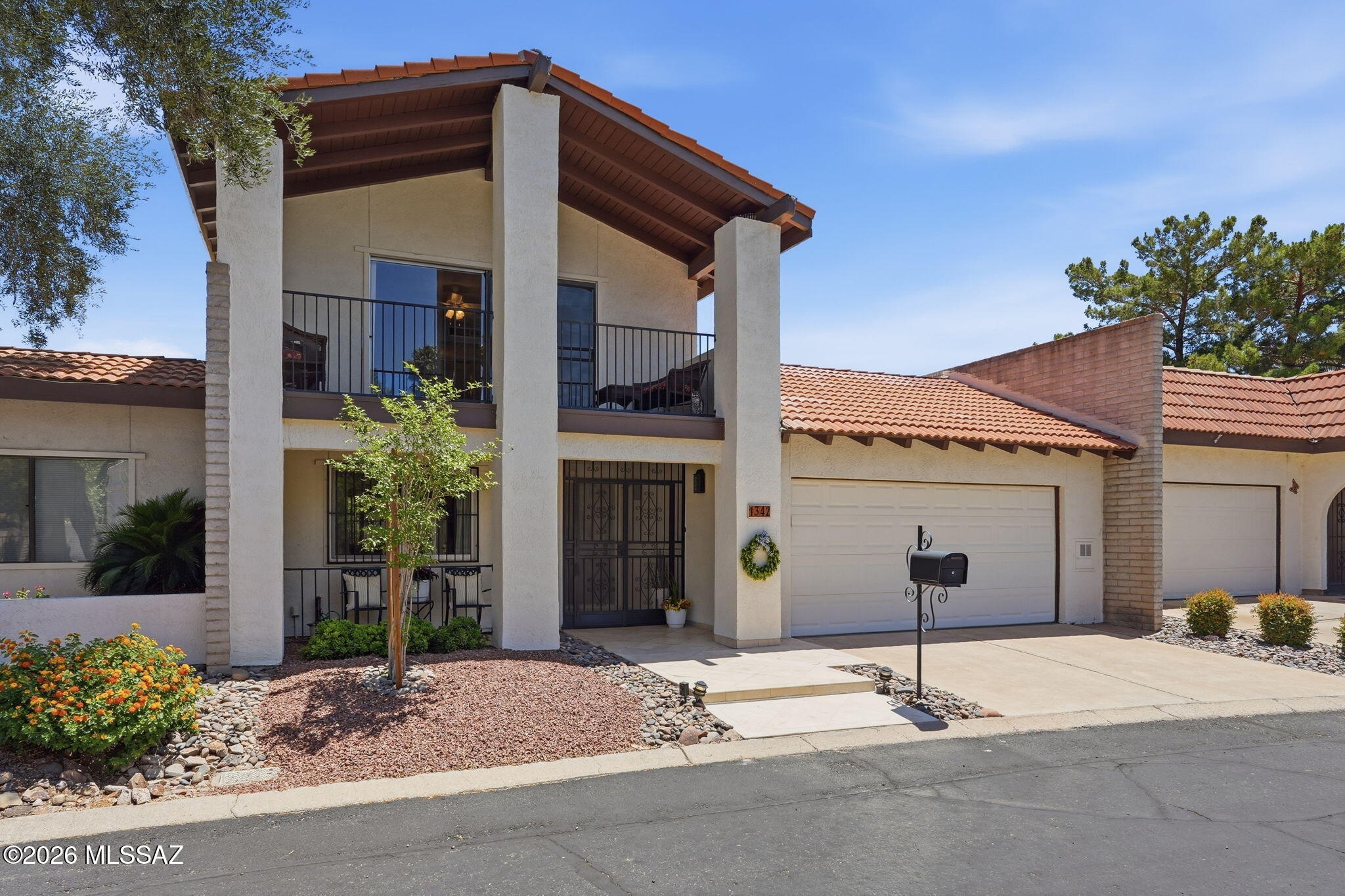 Tastefully updated Dorado Country Club Estates Townhome on a premium view lot overlooking the pond, golf course, and Catalina Mountains. Floor-to-ceiling windows provide abundant natural light. Flexible floorplan with 3 bedrooms and 3 full baths, including first-floor primary suite and guest bedroom for convenient single-level living. Upstairs guest suite features private balcony. Updated Kitchen with Maple Cabinets with pullouts and Granite Counters. Travertine tile flooring, recessed lighting, ceiling fans, six-panel doors, and generous storage throughout. Enjoy private oasis community pool, spa, gazebos, pond and stream. Nearby guest parking.