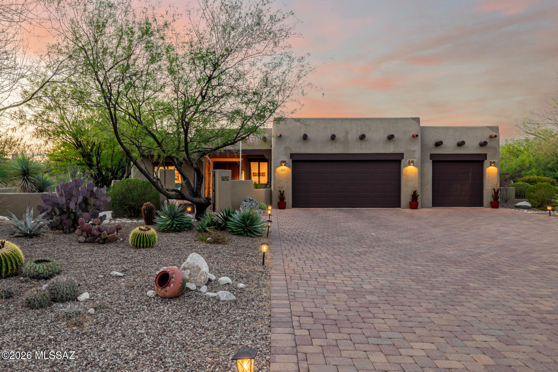 Perched to capture breathtaking 360-degree views of the surrounding canyons and mountains, this exquisite 3-bedroom, 2.5-bath home is a masterclass in architecture, nature, and thoughtful design. From the split floorplan to the oversized garage and NEW HVAC, every element has been crafted for beauty, comfort, and functionality. Step outside and enjoy the fully fenced front, rear, and side patios--each with custom gates--ideal for relaxing, entertaining, gardening (supported by a rain catchment system), or simply soaking in the abundant bird and wildlife. Two tranquil water features and roll-down blinds create peaceful, shaded outdoor retreats. Inside, the open-concept great room is a statement in classic Southwest sophistication, featuring custom wood beams, a kiva fireplace, and seamless flow into the banquette dining area and extended custom chef's kitchen. The kitchen is a true showpiece with a Viking 6-burner gas range and convection oven, granite countertops with a hand-chiseled edge, a Venetian plaster hood, a custom backsplash, and a walk-in pantry. A formal dining room showcases custom wall finishes by artist Sally Richards, while a spacious den with wood beams and French doors offers views of the front patio--perfect as a home office or studio. Two guest bedrooms are positioned on either side of a shared full bath, offering comfort and privacy for visitors. The primary suite is a serene retreat, blending modern tranquility with old-world charm in both design and finishes. Additional highlights include Anderson windows, a Tesla charging station, and wiring in place for solar power--ready for a sustainable lifestyle.