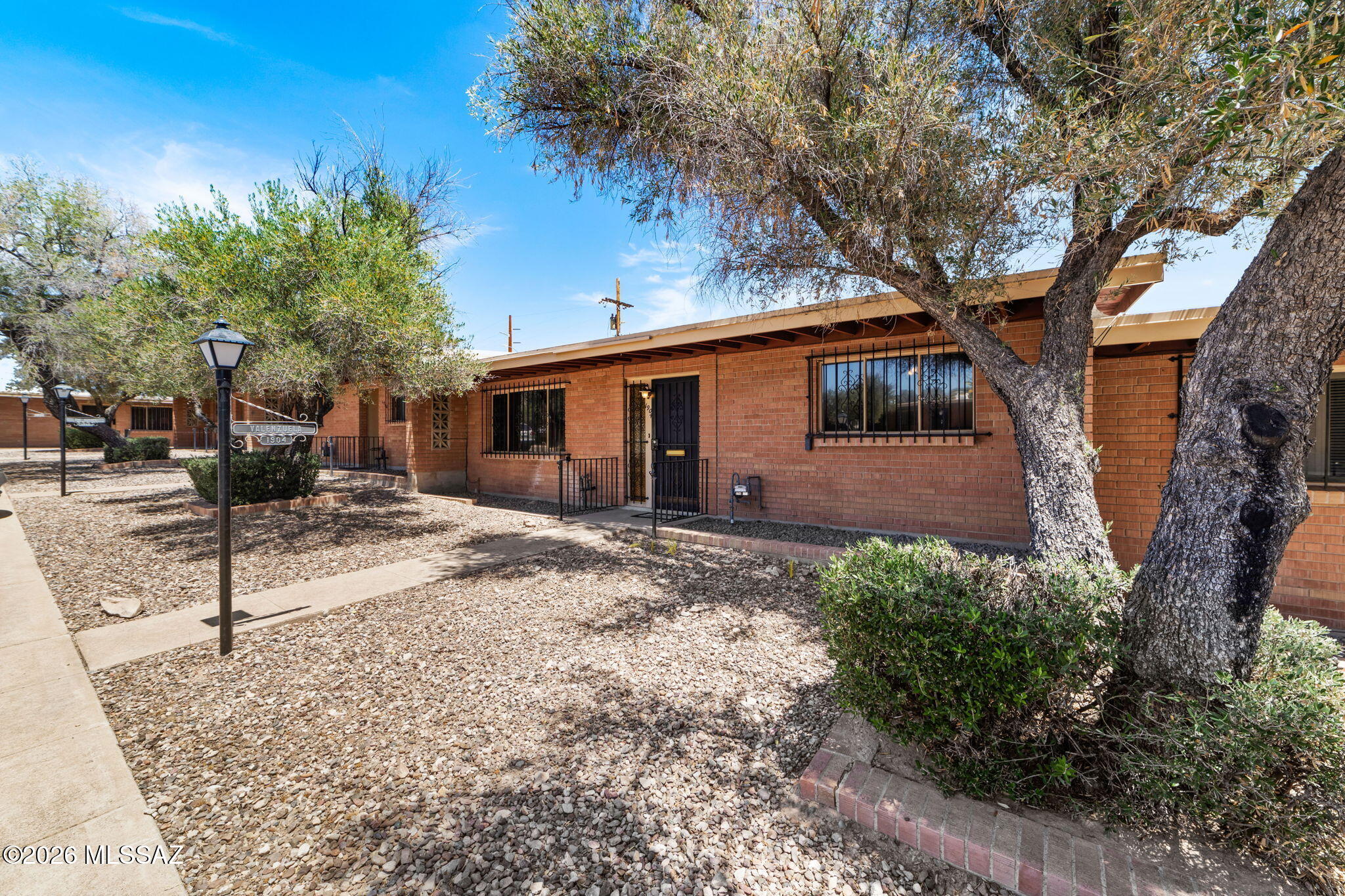 Charming townhome in the desirable 55+ Westwood Hills community in West Tucson (85745)! Surrounded by peaceful desert landscaping & beautiful mountain views, this home offers a private patio perfect for enjoying Arizona's outdoor lifestyle. Inside, find new carpet throughout, fresh interior paint in select areas & two bedrooms, each featuring a walk-in closet. Washer/dryer conveniently located inside the unit. Major updates include a new HVAC system (2020), plus a new water heater & dishwasher (2025). The detached one-car garage includes a private storage closet. Lovingly maintained by the same owner for the past 26 years, this home is ready for its next chapter. The HOA provides exceptional value by covering water, sewer, trash, roof maintenance, pest control, and front yard landscaping.