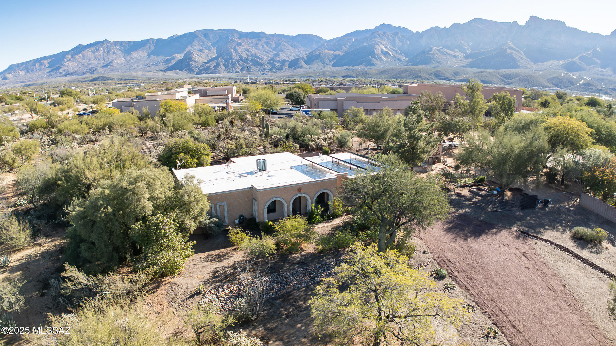 Discover desert living at its best in this beautifully updated Tangerine Hills home, set on just over an acre w/sweeping mountain views. This 3-bed, 2-bath residence offers 1,646 sq ft of comfortable, open living space designed to showcase the natural beauty of NW Tucson. Step inside to updated vinyl plank flooring that flows throughout the main living areas, creating a warm, modern feel. The kitchen features granite counter tops, SS appliances, making it both stylish & functional for everyday cooking or entertaining. Large windows frame dramatic Catalina Mountain vistas, bringing the outdoors into every room. The spacious acre-plus lot offers endless possibilities—outdoor living, gardening, or simply enjoying the peace & privacy. With its blend of updates, space, and unmatched views, this home captures the essence of Tucson living. Welcome to your desert retreat.