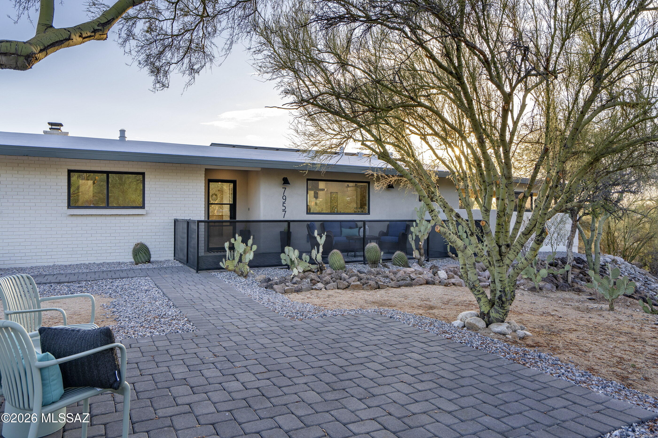 Welcome to another exceptional Lidda Design remodel in the highly sought-after Suffolk Hills neighborhood. Set on nearly an acre w/ stunning mountain views, this beautifully reimagined 4-bedroom, 3-bath home plus dedicated office offers the perfect blend of contemporary design & functionality. Enter through a beautifully designed front courtyard w/ breathtaking Catalina Mountain views, creating an unforgettable first impression. The expansive open-concept kitchen, living, & dining area is filled w/ natural light from oversized sliding glass doors. The showstopping kitchen features designer cabinetry, quartz countertops, a built-in dining table, & a huge picture window over the sink perfectly framing the mountains. A sleek modern fireplace creates a striking focal point in the main living space. The luxurious primary suite offers a spa-inspired retreat w/ a soaking tub, walk-in shower, & custom walk-in closet. Three generously sized secondary bedrooms provide plenty of space for family, guests, or a flex room. The low-maintenance backyard features a covered patio, turf, & a storage shed, while offering endless possibilities to expand by adding a pool, detached garage, or both (see last picture). Designer lighting, stylish finishes, abundant storage, & a spacious laundry room w/ a sink & built-ins complete this stunning remodel. A private rear entry w/ a custom metal gate provides added privacy & security. A rare opportunity to own a move-in-ready Lidda Design masterpiece in one of Tucson's most desirable Casas Adobes neighborhoods, just minutes from restaurants, shopping, & Finger Rock Trailhead.