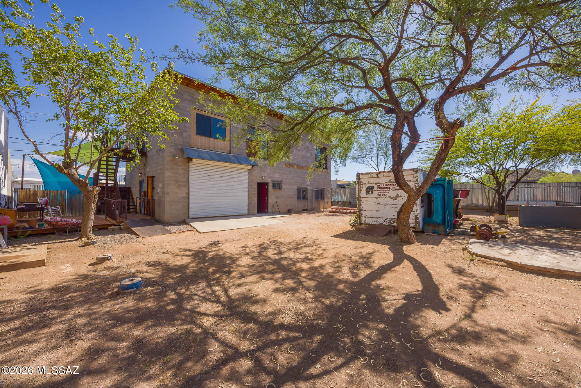 Live and work at your own private sanctuary! Unique property with excellent business potential! Huge working garage and separate workshop/storage downstairs and a fantastic living space or convenient office space upstairs. Large lot is completely fenced with security gate. So many possibilities and opportunities with this unicorn property!