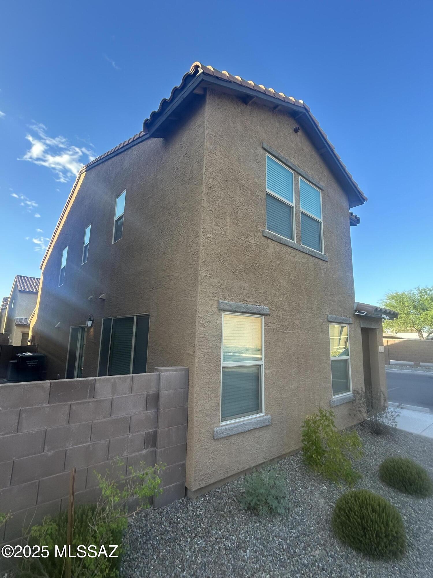 Spacious 3 Bedroom, 2.5 Bathroom home located just 3 miles north of University of Arizona in a newer community.  Open floor plan with tile and carpet in all the right places. Kitchen features features quartz counter tops, stainless steel appliances, gas range, island and pantry. Large great room and half bath complete downstairs. Upstairs include 3 bedrooms, 2 bathrooms and a laundry room.  Blinds and ceiling fans throughout. Low maintenance front and backyard. 2 car garage. Located just minutes to University of Arizona, Eller College of Management, Banner University Medical Center, Shopping, dining and so much more.