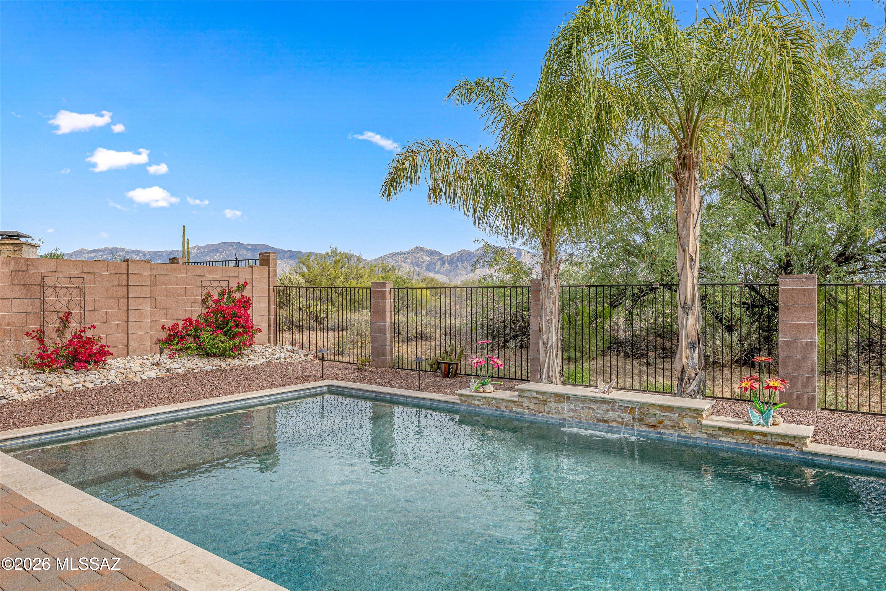 Rare 3,664 sqft, 6bd/5ba former model home, with 4-car tandem garage on a premium lot. Range priced 785k-799,999 Resort-style backyard with Catalina Mountain views. Main level includes 2bd/2 full baths: Upstairs loft and den serve as flex space. Remodeled kitchen with granite countertops, stainless steel appliances, and opens to the main living areas.
Oversized primary suite features a remodeled bathroom with soaking tub and private balcony with mountain views. The backyard is designed for entertaining, with a custom-built pebble
sheen pool, travertine decking, water feature, and built-in BBQ. Stacked
stone accents on all pillars add a custom touch, and mature fruit
trees include three varieties of orange, Lisbon lemon, and limequat. Look no further, this is your home.