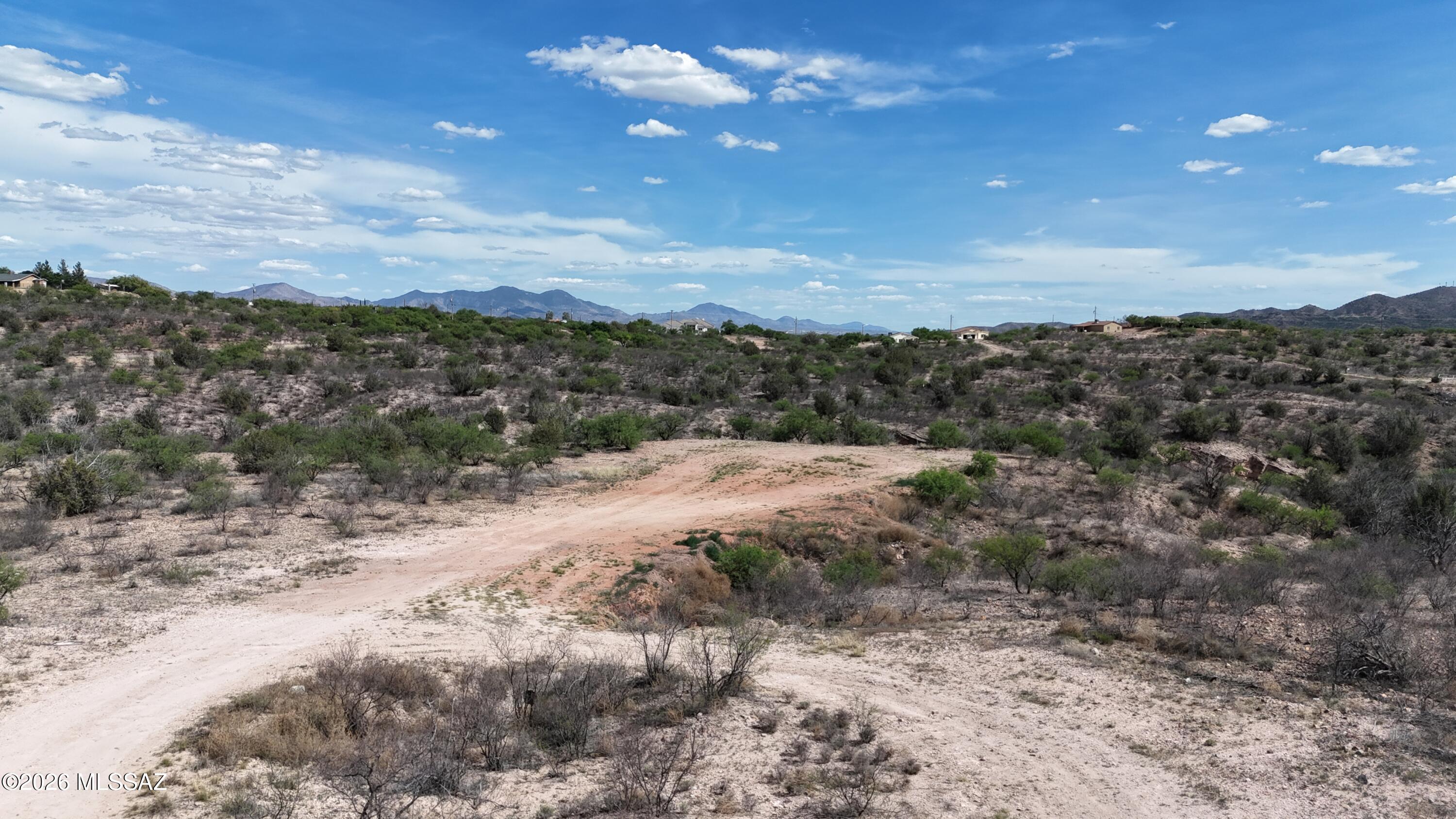 Lot on the end of a cul de sac.  Paved access.