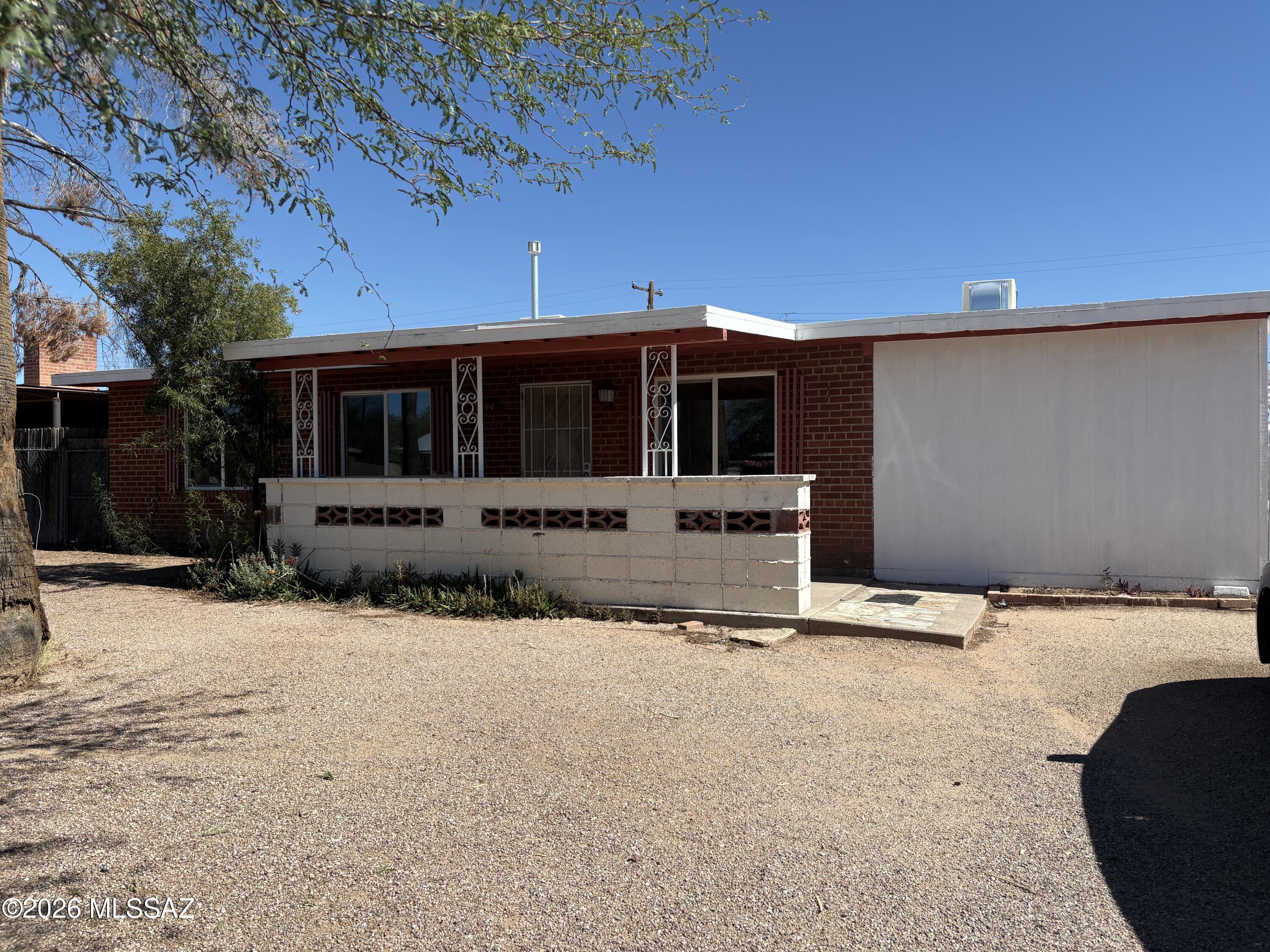 4 bed/2 bath. Freshly painted interior with tile throughout. Covered rear porch.