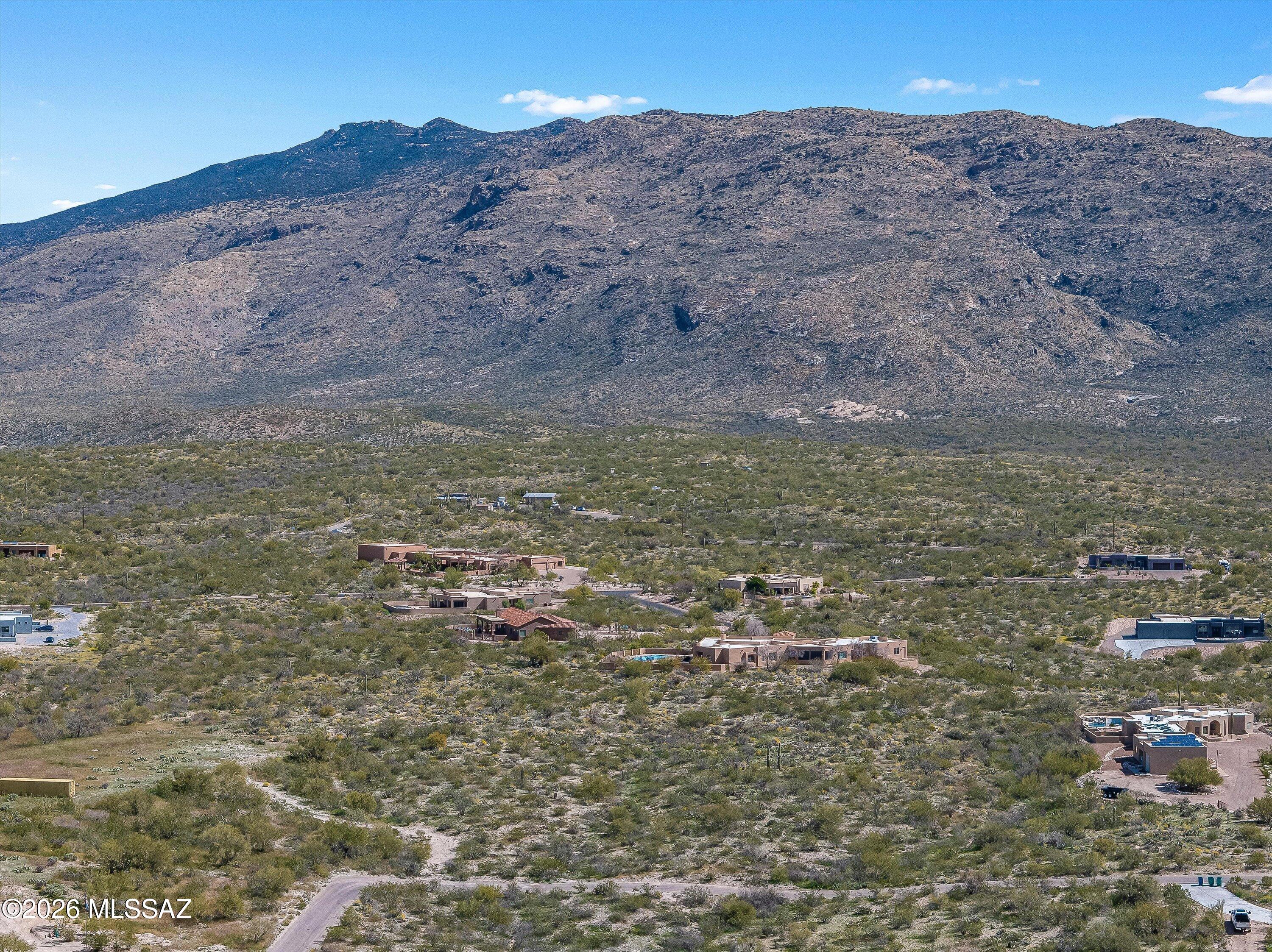 Build your dream home on this beautiful 3.32-acre lot featuring an abundance of native Sonoran Desert vegetation. Located near Saguaro National Park East with no HOA, this property offers the perfect balance of privacy and natural beauty; deed restrictions apply. The elevation features a gradual West-to-East slope, providing spectacular 360-degree views: the Rincons to the East, the Santa Catalinas to the North, and the Tucson Mountains and city lights to the West. Choose the best orientation for your home to capture every sunrise and sunset. Electric is at the lot line. Septic is required and the property is ready for a private well. A rare opportunity for a custom build on a pristine, elevated desert site.