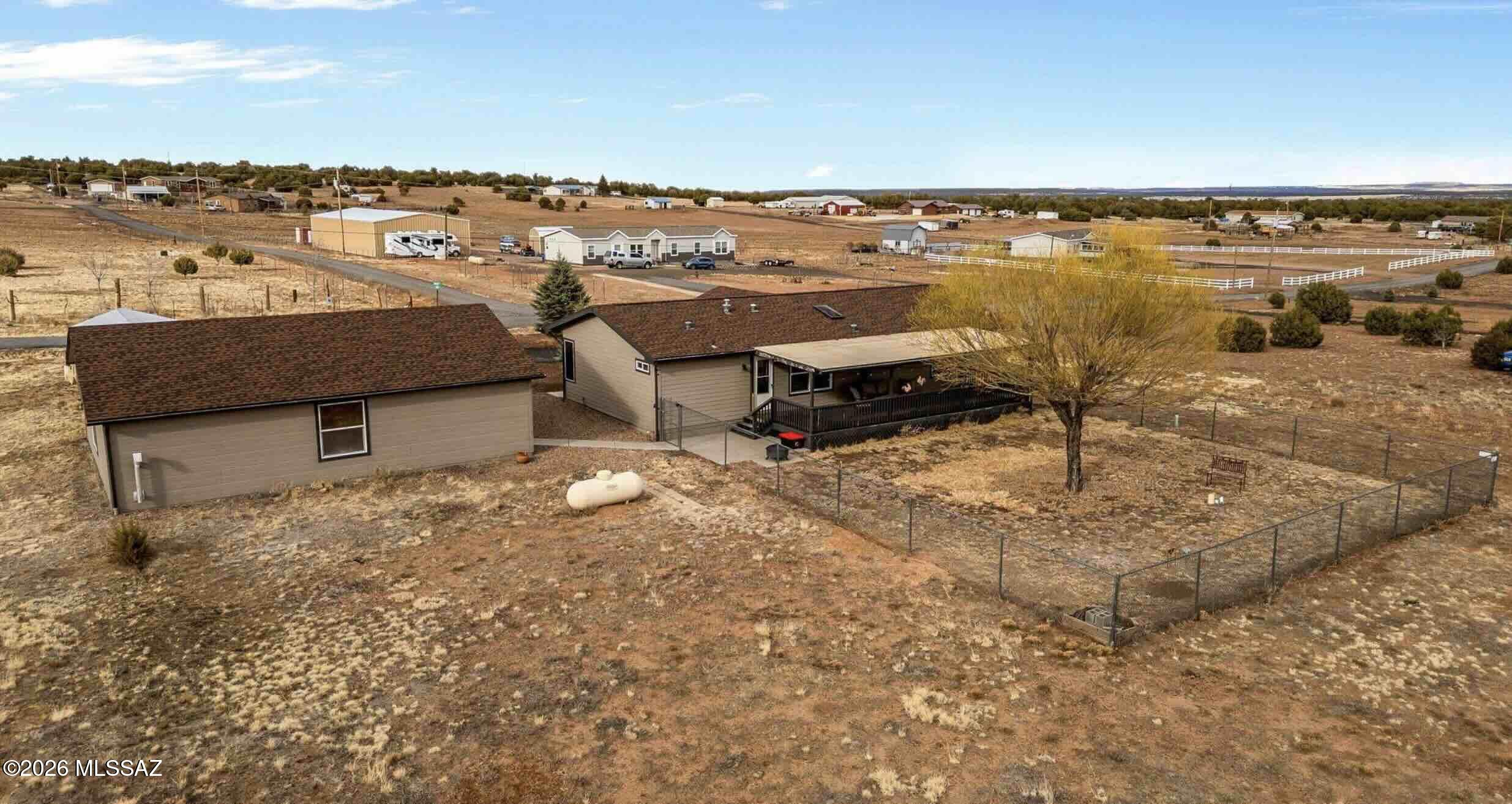 Are you looking for a meticulously maintained home with 2 acres of horse property located in a peaceful setting near the National Forest boundary? This home will be your opportunity to escape to the mountains with a cooler climate and elk as frequent visitors! The home sits on a ''solid slab'' foundation, is well laid out in a split floor plan and boasts a complete new central air system! The home has an inviting and spacious living room adjoining the kitchen and dining area. The kitchen has been remodeled, offering solid oak cabinets, new countertops, sink and most appliances. In the master suite you will find ample space, a nice walk in closet and an oversized bathroom. There are walk in closets in each of the guest bedrooms. This home has plenty of storage with additional cabinets in the laundry. Outside you will surely be impressed with the ultimate
30'x36' garage/shop. This garage is insulted/heated with a pellet stove and has enough room to park up to three vehicles/toys. Garage is loaded with storage cabinets and workspace. There is also a 12'x22' storage shed near the garage. With everything this home and property have to offer, now is the time to make your move.
