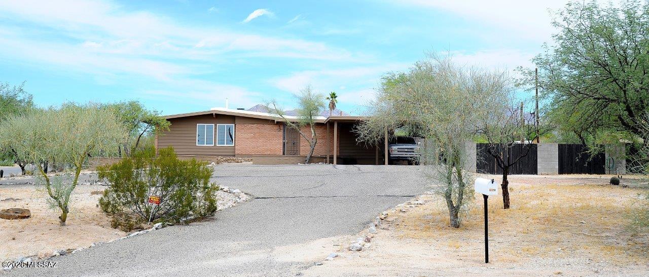 Great convenient location on .60 acre in established neighborhood of Oracle Foothills Estates near Orange Grove/La Canada!  1923 SQ.FT. 3 bedroom/2 bath with large conventional pool and no carpet!  New paint inside/out & new roof in 2026, new HVAC system in 2023, pool replastered in 2024 and sewer line relined in 2019 with warranty.  Hickory cabinets in kitchen with quartz and all appliances included.  Large fenced rear yard with covered patio at rear of home plus a pool!  Formal dining area plus family with fireplace.  Large recreation room/media room.  Laundry room off back patio with storage plus washer/dryer.