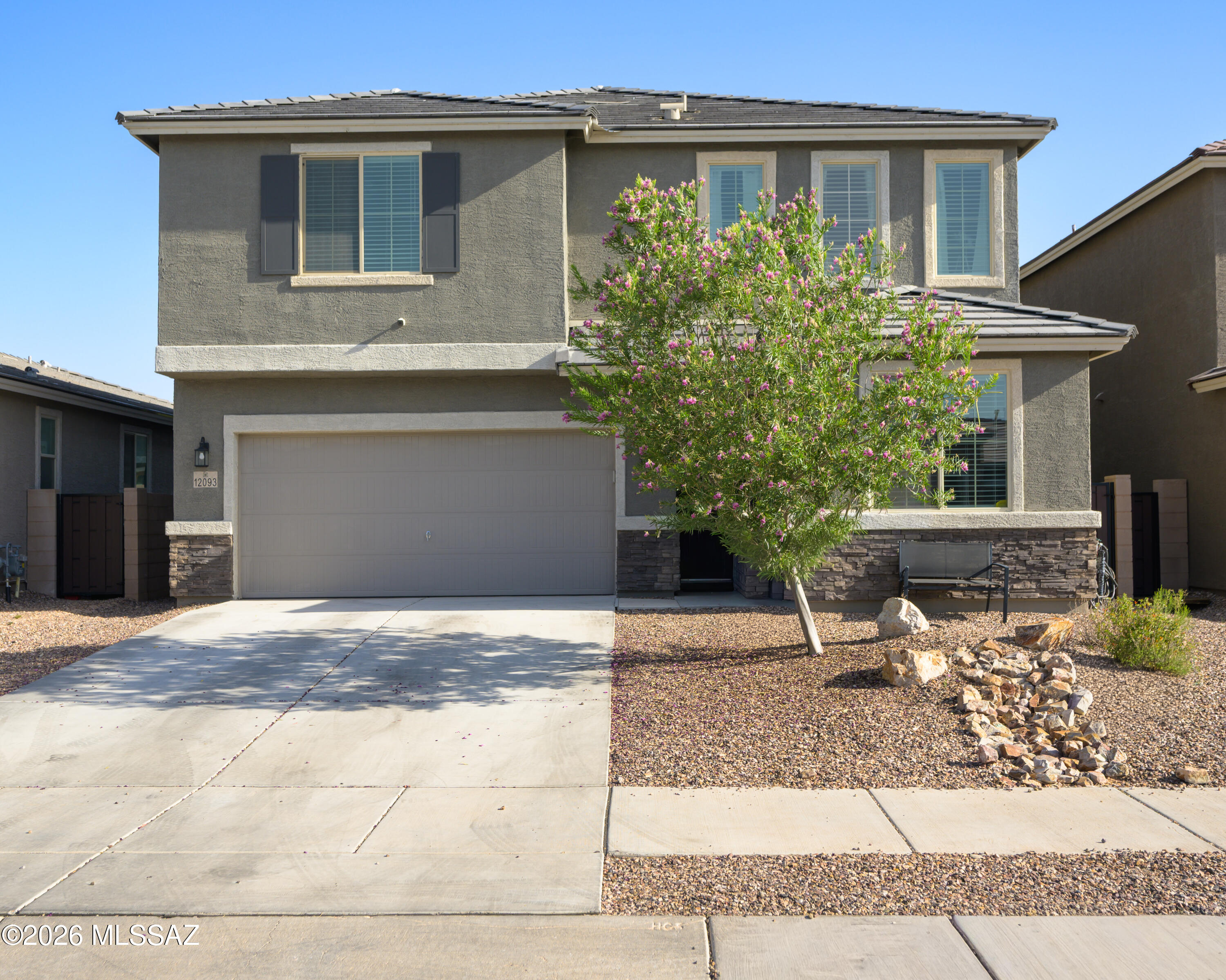 This gorgeous Moonstone home boasts a stylish two-story design with four bedrooms, three bathrooms, and a versatile bonus room that could serve as a fifth bedroom. Combining comfort with modern flair, it offers a fully landscaped backyard featuring artificial turf, pavers, and a wide covered patio perfect for entertaining. With over $50,000 in upgrades, the kitchen impresses with premium finishes, stainless steel appliances, granite countertops, and a spacious island, complemented by upgraded floors and extra windows. Upstairs bedrooms feature large walk-in closets, a large loft with mountain views, and an oversized laundry room with a washer and dryer (Included). Additional perks include a security system/Cameras. Water RO system/Alkaline. Newer 10-kilowatt solar PV system installed.