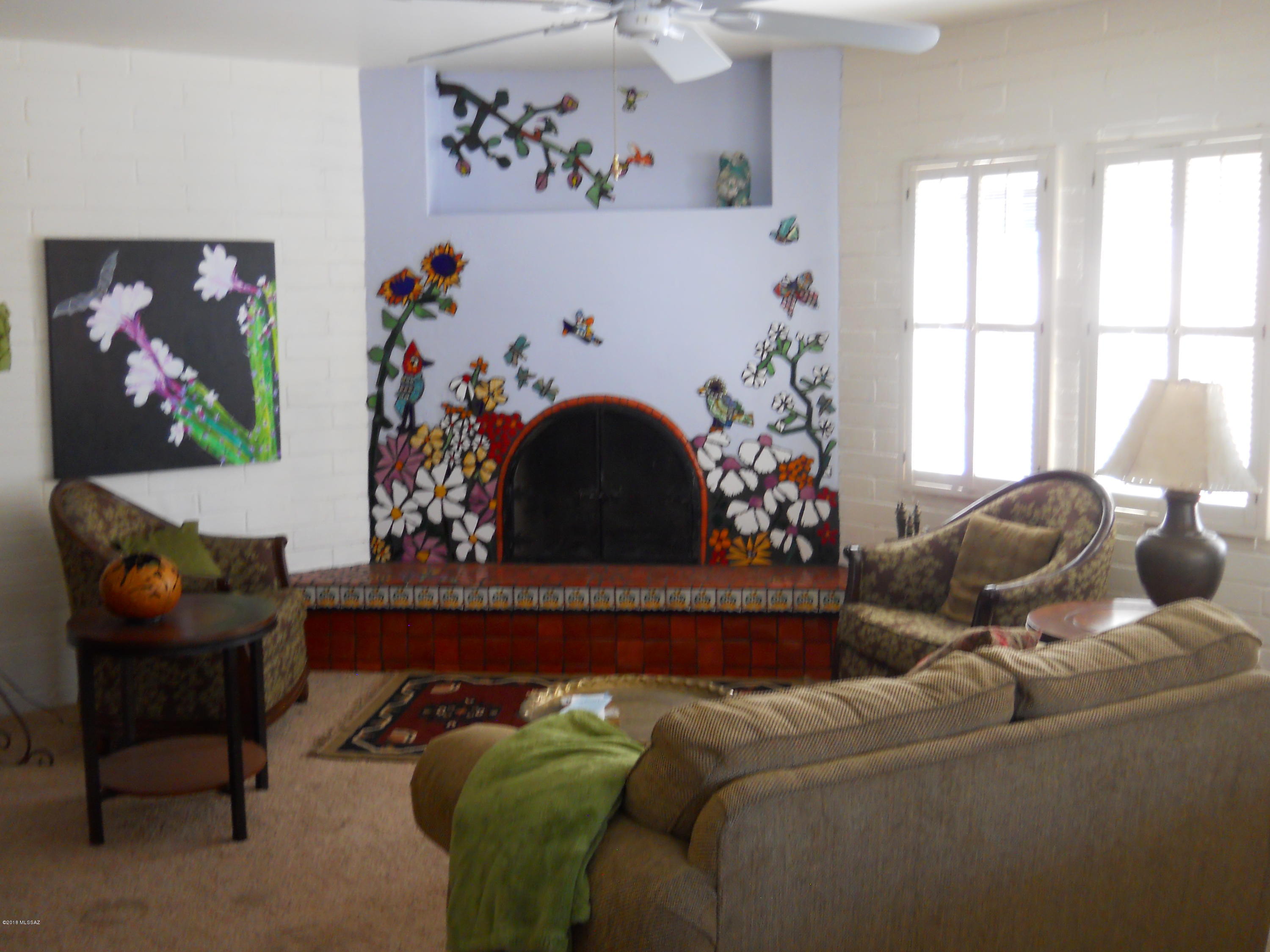 Right in the middle of Green Valley.  Close to everything!  Light and bright with skylights, 2 covered patios completely walled in, one with mountain view, one with a large additional open patio and a gate to the walking trail. Custom artwork, Beehive fireplace, expanded to 1450 sq ft. appx.  Private, quiet, spacious. Custom artwork, Beehive fireplace, expanded to 1450 sq ft. appx. LOTS of storage and closet space.  Two parking spaces off the street, one covered.  End unit.  Maximum 45% debt to income ratio and credit score over 650. owner/agent