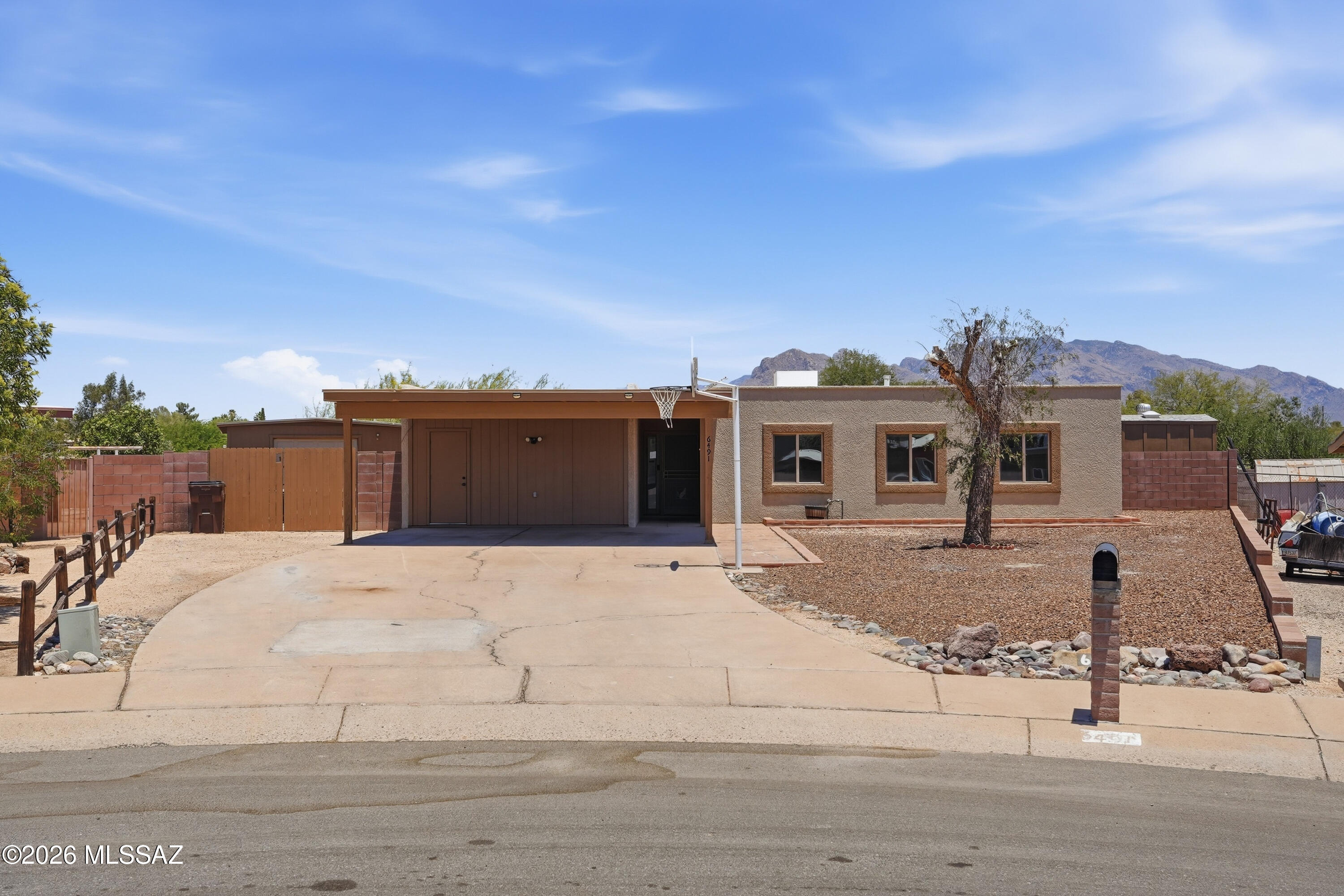 No Application Fees! Beautifully remodeled single level 3-bedroom, 2-bathroom Tucson home with a private fenced pool. This open floor plan home features wood plank style tile flooring throughout all living and high traffic areas with neutral carpeting in the bedrooms, upgraded doors and fixtures, ceiling fans throughout, two-tone neutral paint, and abundant natural lighting. The spacious living room and formal dining area flow into the beautifully remodeled kitchen featuring extended countertops, tile backsplash, breakfast bar, separate pantry, ample cabinet space, and stainless-steel appliances including range, microwave, dishwasher, and refrigerator. A separate bonus family room provides valuable additional living space for entertaining, relaxing, or a home office setup. The primary suite features a walk-in closet and updated private bathroom with new vanity and tiled tub/shower surround. Washing machine and dryer are included for convenience.

The spacious backyard is designed for Arizona living and includes an extended covered patio, sparkling fenced pool, synthetic grass area, and added privacy with no rear neighbors.

Convenient northwest Tucson location close to shopping, restaurants, parks, schools, golf courses, and outdoor recreation. Easy access to major Tucson employment centers, hiking and biking trails, and numerous dining and entertainment options throughout the area.

All Denali Real Estate residents are automatically enrolled in the Resident Benefits Package (RBP) for $55.00/month which includes Renter's Liability Insurance, Credit Building to help boost the resident's credit scores with timely rent payments, up to $1M Identity Theft Protection, HVAC air filter delivery (for applicable properties), our best-in-class resident rewards program, and much more!