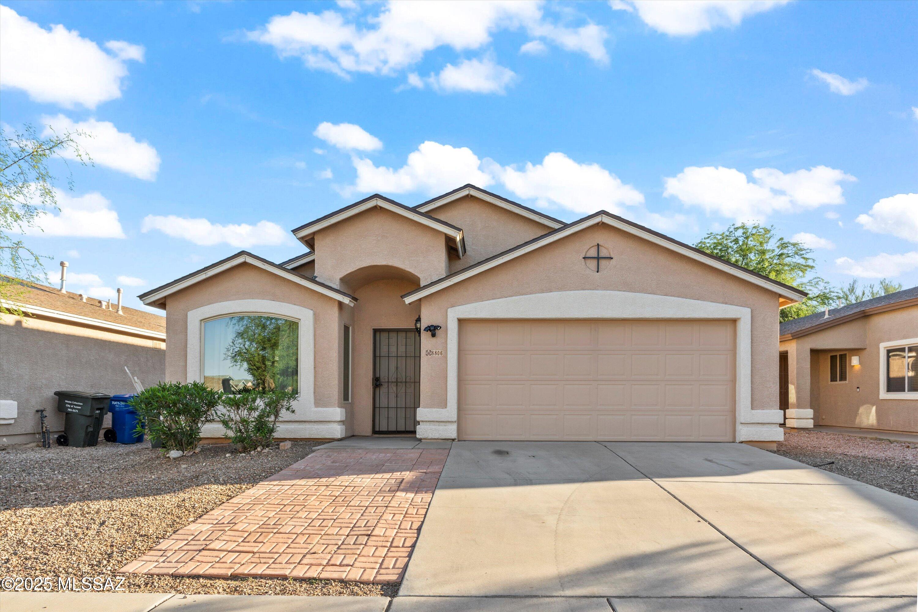 The roof, HVAC, and solar are already handled here, so all that's left is moving in. This Rita Ranch home pairs a traditional living room with a separate, open concept kitchen and great room, where a big island, newer countertops, appliances, and sink make the space easy to use. Vaulted ceilings and a cozy fireplace give the great room its warmth, while new flooring, fresh paint, and updated baseboards carry that same clean feel through the rest of the house. The Lennox HVAC is newer and still under warranty, the windows were upgraded for efficiency, the roof was replaced in 2023, and the solar is fully paid off, so utility costs stay low for years to come. Add a 2-car garage, a private backyard, and low HOA dues for an easy, efficient home close to shopping and the interstate.