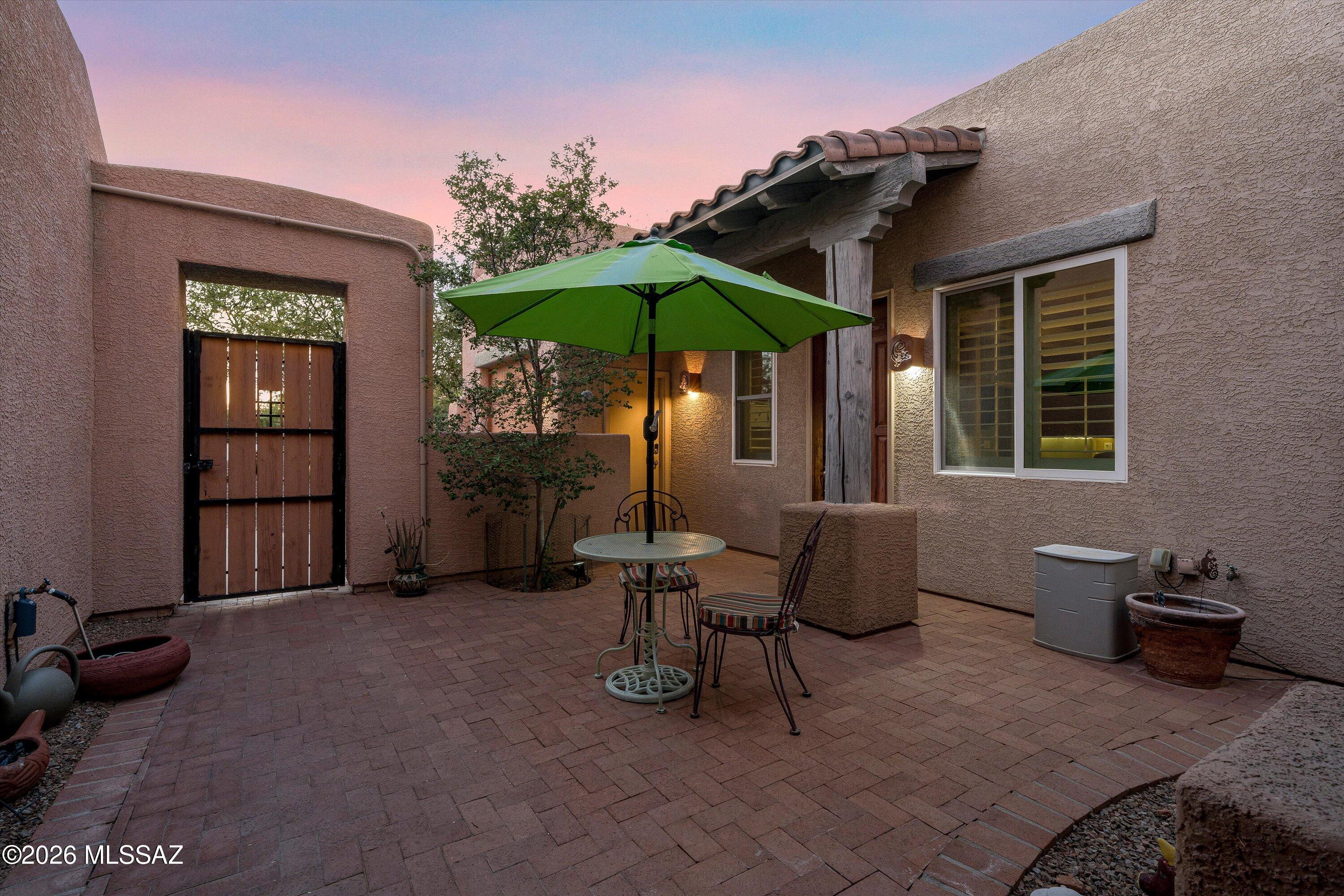 As you walk through the courtyard of this Rancho Vistoso home you can't help but anticipate what is behind the door.  This 2-bedroom 2-bath home features a great room, formal dining room, large eat in kitchen, and an office with built-in desk and bookcases.  Whether you are soaking in the Hot Tub, sitting by the fire, or cooking up dinner you're sure to enjoy this entertainer's backyard.  If that's not enough, the primary suite is oversized.  In addition to all this there is a detached casita with kitchenette, stacked washer and dryer just waiting for your guest, adult children, or potential income.  This is one you won't want to pass by on your search for the perfect home