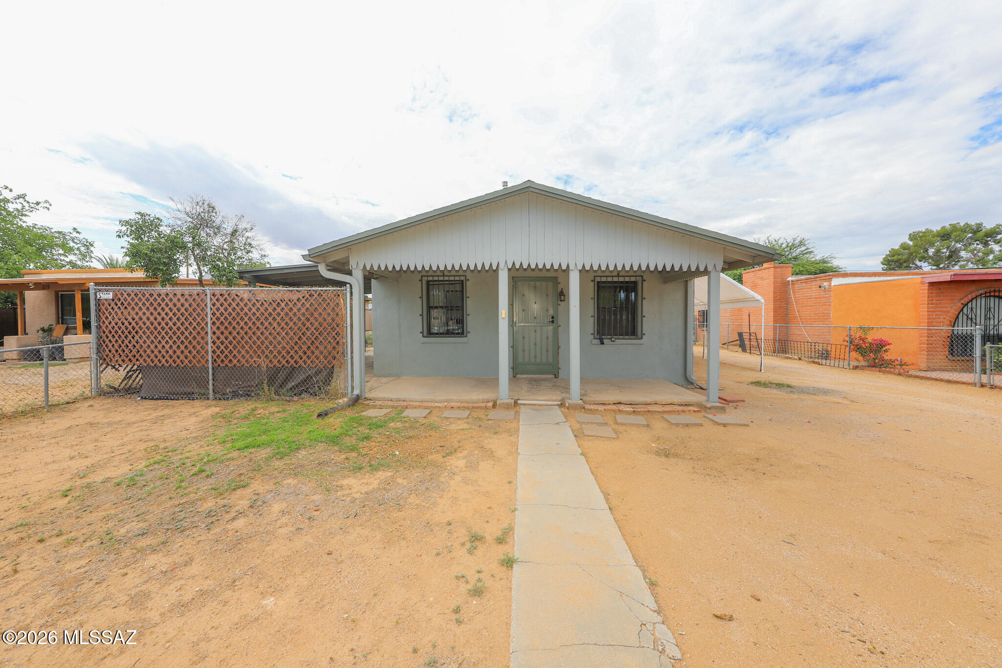 Spacious R-2 lot with a 720 sq ft move-in ready home and a separate workshop with electric & water. Large insulated tuff shed conveys as well as all the appliances & the trampoline! HVAC installed in 2018, large tuff shed & new roof installed in 2021, new gas pipes in 2022, new wrought iron installed on all doors & windows of the home, workshop & shed in 2023. Completely fenced with no HOA. Minutes to the freeway. Great opportunity with many possibilities!