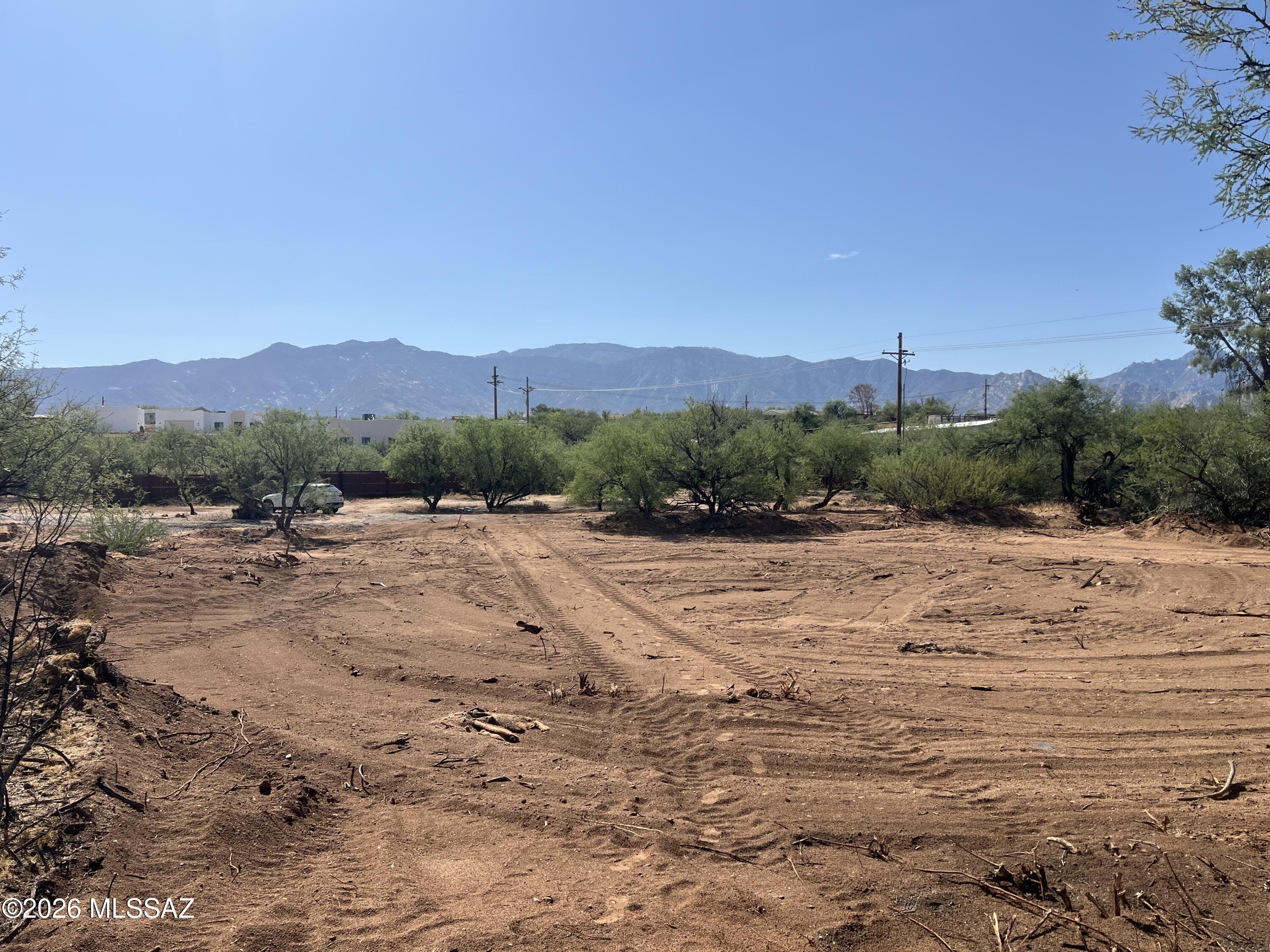 just over 1.5 acres at the foot of the Santa Catalinas with water and power to the lot. building site has been pre engineered for building and pad is Not in the flood zone and can be bult upon. All of the heavy lifting has been done. Lot is approved for Manufactured, modular or tiny homes. Priced right and the last lot available in the community. get it before its gone