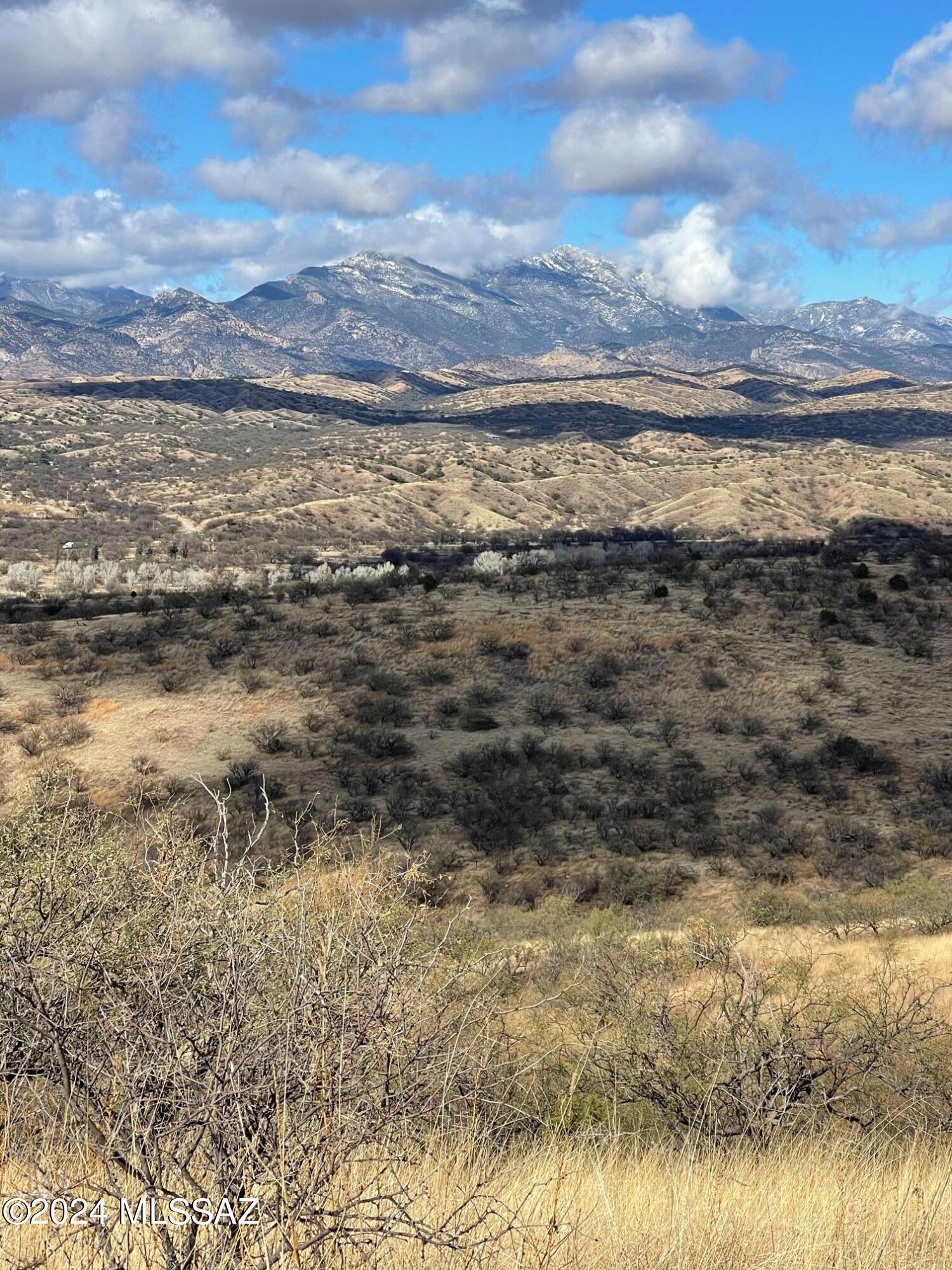 Large 22 ac Parcel tucked up on Butte East of Town but still close . This hilltop has 360 deg views, you decide best views for your house with the Panoramic Mountain Views or Valley Town views,  Seller is willing to offer Solar power concession . Semi remote yet still close to Patagonia businesses.  Adjacent lots available for sale, Buyer Could combine and have over 44 ac Ranchette.