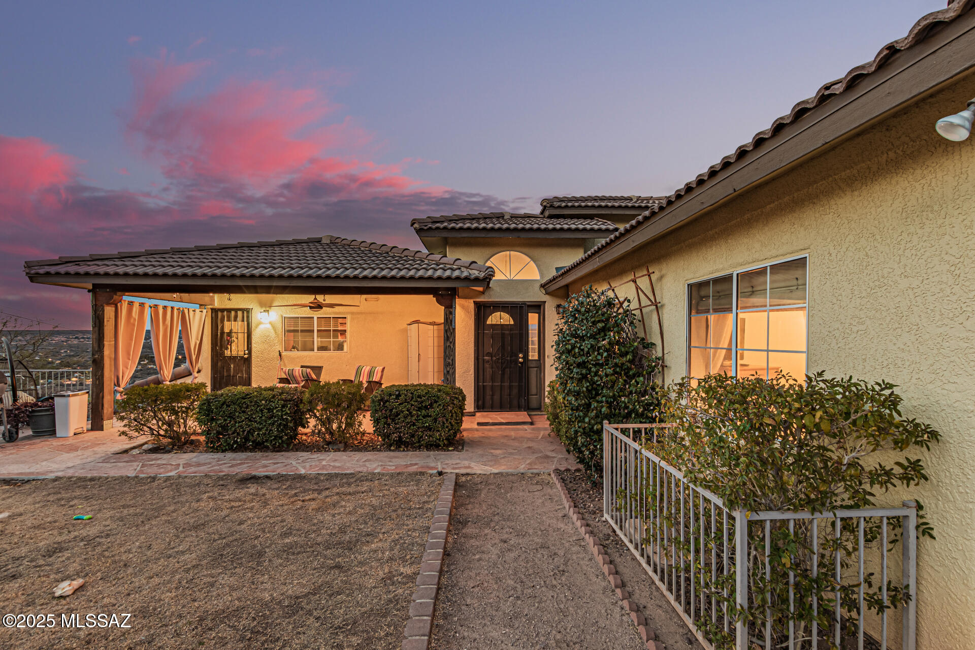 Seller will accept or counter offers between $620,000 and $649,000. SCENIC CATALINA VIEWS - ESTABLISHED HORSE PROPERTY- POOL-NO HOA! Rare 1-acre Catalina Mountain view with established horse property, a pool, barn setup, and direct access to Coronado National Forest trail systems. Enjoy breathtaking sunrise, sunset, and moonrise views in a private desert setting just minutes from town and close to the renowned Miraval Resort. This 2,917 sq ft split-level home offers a highly flexible, non-traditional layout with 4 bedrooms, 3 full baths, and 2 half baths. The upper level features a loft-style design with open living space that can remain as-is or be further defined, including potential enclosure of approximately 500 sq ft for expanded use or dual-living flexibility such as guest space, air bnb, or rental-style potential.

Ideally located near Coronado National Forest, the property provides immediate access to miles of hiking, biking, and horseback riding trails, including routes leading toward the popular 50-Year Trail system.

Offered as-is, the home provides a strong structural foundation with existing improvements and generous square footage, allowing buyers to personalize over time. Pricing is strategically positioned to broaden the buyer pool and highlight overall lifestyle, usability, and long-term value rather than strict comparison-based decision-making.

A rare opportunity to own an established horse property featuring a functional tack and hay barn setup, usable horse facilities, and land suitable for goats, chickens, and small livestock--ideal for a self-sustained desert lifestyle.

Outdoor living includes a sparkling pool, two covered patios, and an additional open patio perfect for entertaining or enjoying the peaceful desert setting. Mature landscaping, shade trees, and producing fruit trees enhance privacy and serenity.
Recent upgrades include two newer AC systems and a newer water heater.

One note for equestrian buyers: the property accommodates standard horse trailers and equipment, while larger rigs or extended-length trailers may require additional consideration when accessing the lane.

Blending privacy, flexibility, equestrian functionality, and unmatched Catalina Mountain views, this property offers a rare desert lifestyle opportunity with both seclusion and convenience.
