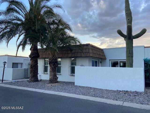 2 bedroom, 2 bath townhome with newer roof and windows.  Kitchen has stainless steel appliances and granite counters.  Fireplace in living room and patio off living room and master bedroom.  2 covered assigned parking spaces and storage off carport area.  HOA fee covers water sewer and garbage.  Nice location with easy access to town.  Lots of value here, take a look.