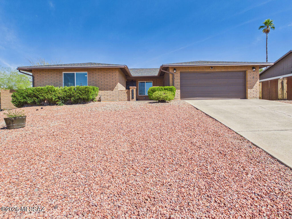 Newly renovated home in Rolling Hills located on the east side of Tucson! No HOA is a big plus. This home features 4-bedrooms, 2- bathrooms, a bonus room, and a 2-car garage. New roof with transferable warranty (2025). Beautiful upgrades inside this home. Upgrade list available upon request. 

Discover the chic style, a blend of all the comforts of home, and modern living at its best. Great curb appeal with a nice courtyard leading to the front door. 

The interior floor plan includes a family room, a formal dining area, a living room with a wood burning fireplace for quiet nights with the family, and a large bonus room that can function as an office space or gym. You can also use the bonus room as a bright sunroom perfect for enjoying the warm Arizona weather year-round. Additional features include all new dual pane windows, new soft carpeting installed throughout a portion of the home completing the tile flooring in the main living spaces. This home is a must see.
 
The gorgeous kitchen boasts quartz countertops, lots of wood cabinetry, recessed lighting, new stainless steel GE appliances, a pantry closet, & a peninsula w/ a breakfast bar for casual dining. The primary bedroom has a sliding door access to the backyard, soft carpeting, a built-in closet w/ mirrored doors, and an ensuite bathroom  w/ dual vanities, quartz countertops, and an elegant tile shower from floor to ceiling. The remaining bedrooms are ample size and share the hallway bathroom with a single vanity, quartz countertops, and a tub/shower combo.
 
The laundry room is located inside. Washer & dryer convey. 

Unwind in the backyard, under a covered paver patio & a large citrus tree with lots of room for planting a garden or use the space as the perfect place for an outside BBQ with friends and family. Make this upgraded gem yours now!