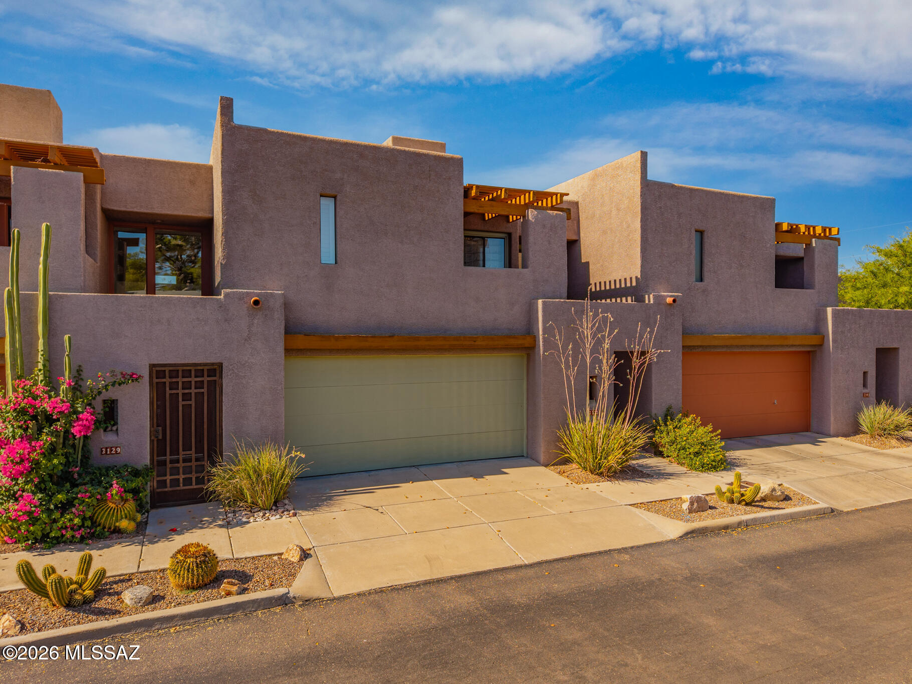 Serve up an exceptional Tucson lifestyle at Sampras Lane. This architecturally distinctive townhome blends contemporary Southwestern design with soaring ceilings, abundant natural light, a cozy fireplace, and private indoor-outdoor living spaces. Enjoy a welcoming courtyard entry, low-maintenance backyard, and multiple outdoor retreats perfect for Arizona living. Located just steps from the Tucson Racquet & Fitness Club and moments from The Loop, Tucson's premier biking, running, and walking trail system, this home offers a true home-court advantage for active lifestyles. Conveniently situated near the University of Arizona, dining, shopping, and medical centers, this is match point for buyers seeking style, convenience, and location in the heart of Tucson. Short Term rentals allowed.