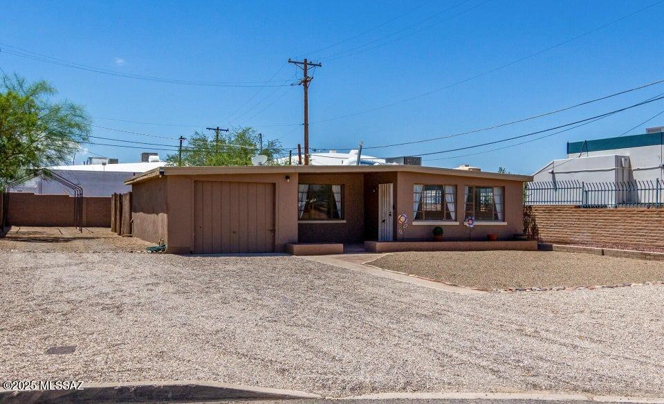 Beautiful 2 bedroom, 1 bath rental in Central Tucson near the University of Arizona, Reid Park, and Banner University Medical Center. This spacious front unit features a bright living area, tile flooring, and a large one-car garage with laundry hookups that can double as storage or a small workshop. Enjoy a private fenced backyard perfect for pets, gardening, or outdoor living. Located on a quiet U-shaped street close to shopping, dining, bus lines, and major Tucson employers. A rare Central Tucson rental with private parking, garage space, and an ideal location for U of A students or medical professionals.