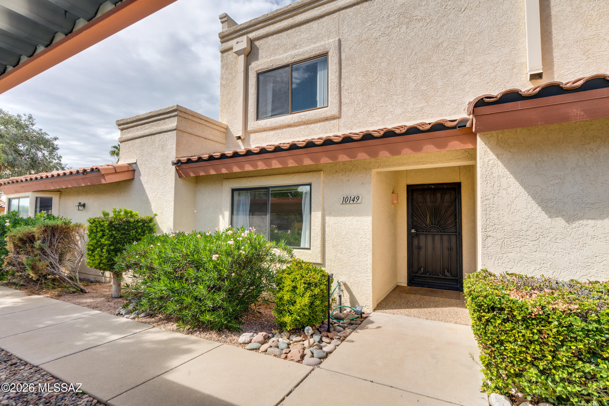 3 bedroom and 3 full bathroom Townhome available in desirable East side Coronado Ridge community.  1 bedroom and 1 full bathroom on the main level. 2 primary bedroom options upstairs with en-suites. North facing backyard with a Balcony off the Primary Bedroom with foliage and mountain views. Great room with breakfast bar seating, beautiful solid wood cabinets, and kitchen appliances convey. New Water heater 2023, New HVAC 2020, new SS Refrigerator 2024, New Dryer 2024.  HOA covers Roof, Exterior maintenance, trash, private streets, front landscaping, common area maintenance, community spa, pool and rec room. Townhome offers 2 assigned carport spaces with ample guest parking nearby. Sliding glass door access from the great room to covered patio and an adorable backyard. Mountain views!