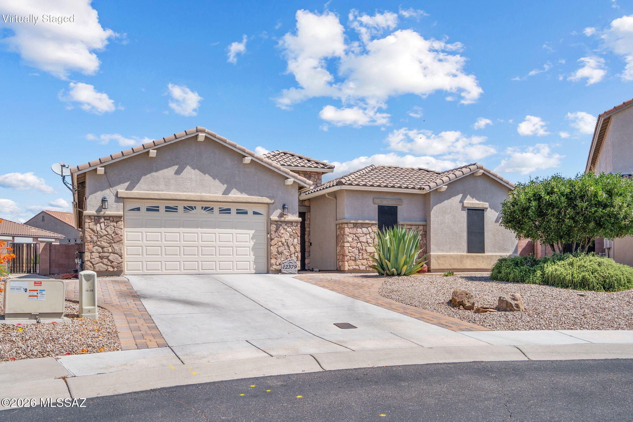 Discover your own private desert retreat in this beautifully updated Marana home, set on an extraordinary .37-acre lot--the largest in the neighborhood. Offering 4 bedrooms, a den, and 3 bathrooms, the home centers around an expansive great room designed for relaxed everyday living and effortless entertaining. Fully renovated in 2022, the kitchen and bathrooms feature upgraded cabinetry, quartz countertops, and modern tile, while the primary bath creates a spa-like escape with a zero-entry shower and soaking tub. Continue the relaxation outdoors in the heated pool and spa or unwind on the screened-in patio. A fully automated smart-home system and whole-home generator bring convenience and peace of mind to this exceptional home.