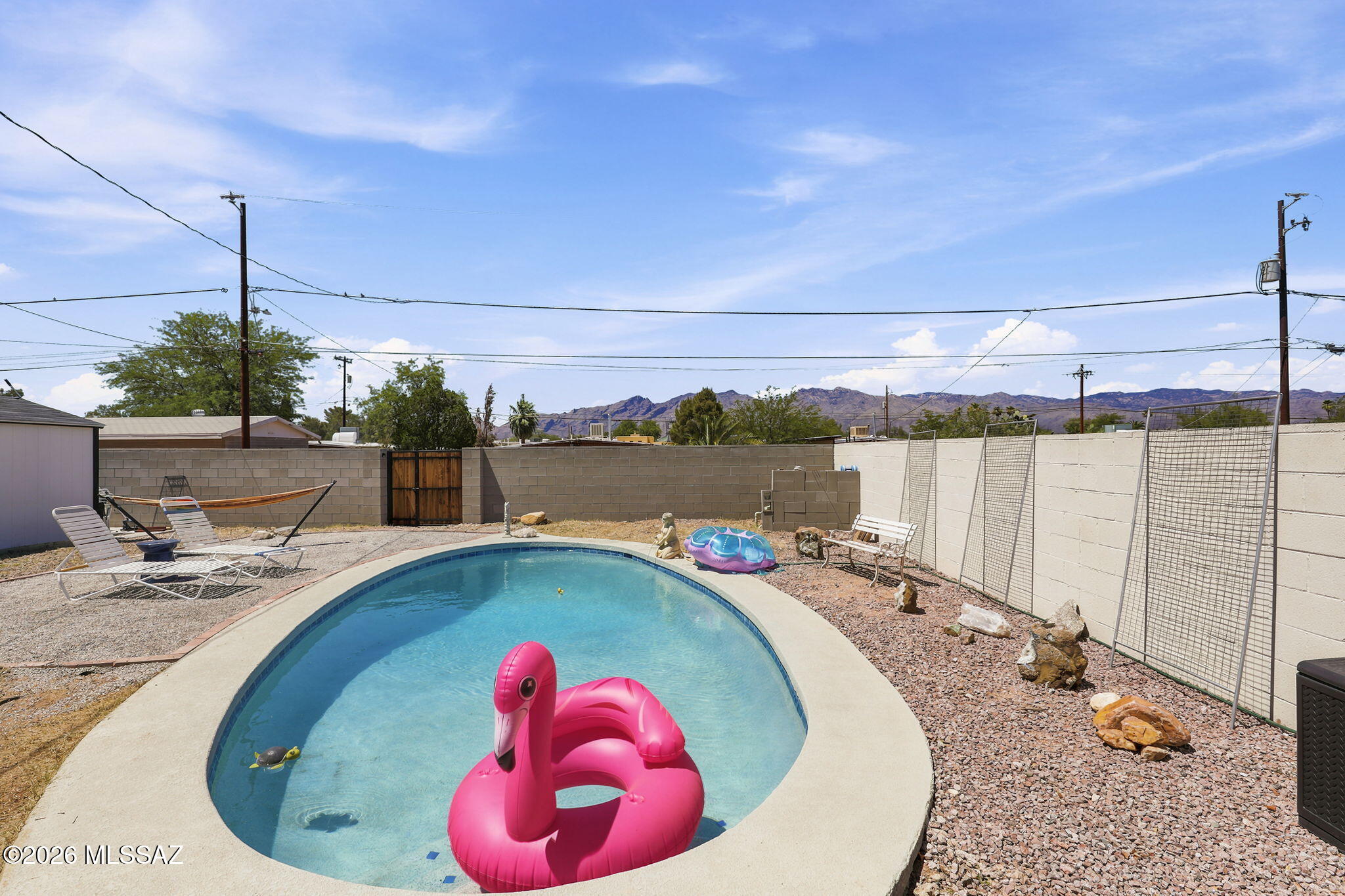 NO HOA! Prime Central Tucson location! This fully renovated, move-in-ready 4 bedroom, 3 bathroom home with a private pool offers the perfect blend of modern updates and versatile living. Upgrades include New Plumbing (3 yrs), HVAC (4 yrs), Roof (3 yrs), Water Heater (4 yrs), new flooring, stainless steel appliances, granite countertops, LED lighting, a water softener system, and beautifully remodeled bathrooms with LED mirrors. The split floor plan can easily be converted into a private studio, mother-in-law suite, or next-gen living space. The primary, second, and fourth bedrooms each feature private access to the backyard. The backyard offers multiple patio areas with new pavers, a large storage shed, peach & lemon trees, grass, and beautiful mountain views. Located on a quiet cul-de-sac and a short walk to the neighborhood park. Minutes from shopping centers, grocery stores, and restaurants. A fantastic opportunity for families, investors, or anyone looking for a home with flexible living space and a backyard designed for entertaining. Ideal for multi-generational living or a private guest suite. This is a must-see and won't last long!