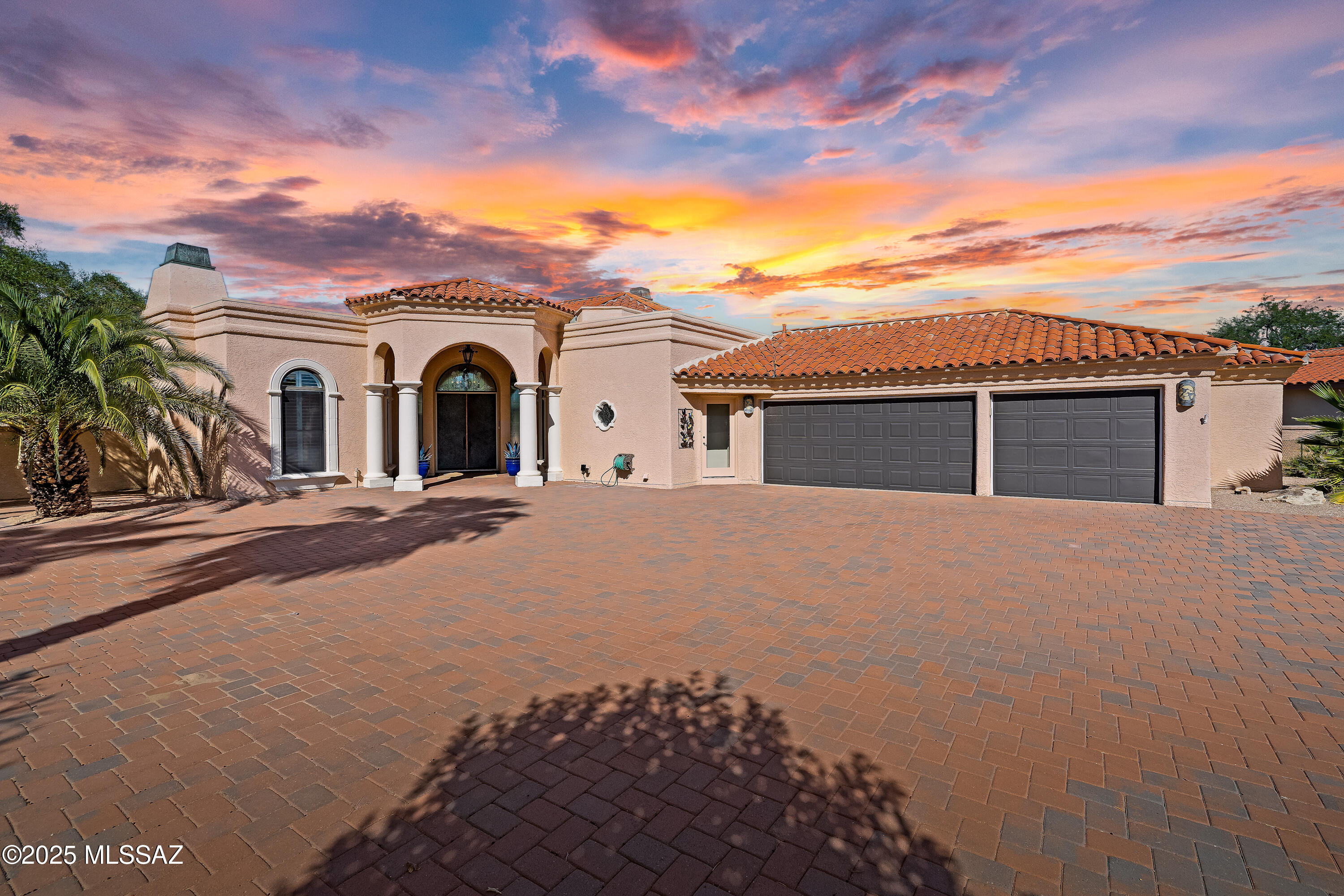 Welcome to this stunning, custom home nestled in the prestigious Nob Hill Estates of Omni Tucson National. Entering through the double copper doors, you'll be captivated by panoramic views framed by 20-foot ceilings and beautiful exposed wood beams in the foyer, great room, breakfast nook and front porch. This home offers warmth and ambiance with three cozy gas fireplaces, a gourmet kitchen featuring Wolf appliances and elegant granite countertops in the kitchen, baths, wet bar, and quartz in
the primary bath. Perfectly situated on the 17th green of the Desert Course, the .51-acre lot provides ample room for a guest house. Outside, enjoy expansive travertine patios, a fire pit with bench seating, and a sparkling pool with a spa. There's even a charming orchard for fresh, seasonal produce.   Homes in Nob Hill are rare to find, especially one that blends style, comfort, and premier golf course living. Don't miss the chance to call this exceptional property your own! Omni Tucson National Resort & Spa offers discounted memberships to residents, please inquire at the membership desk inside the resort.
