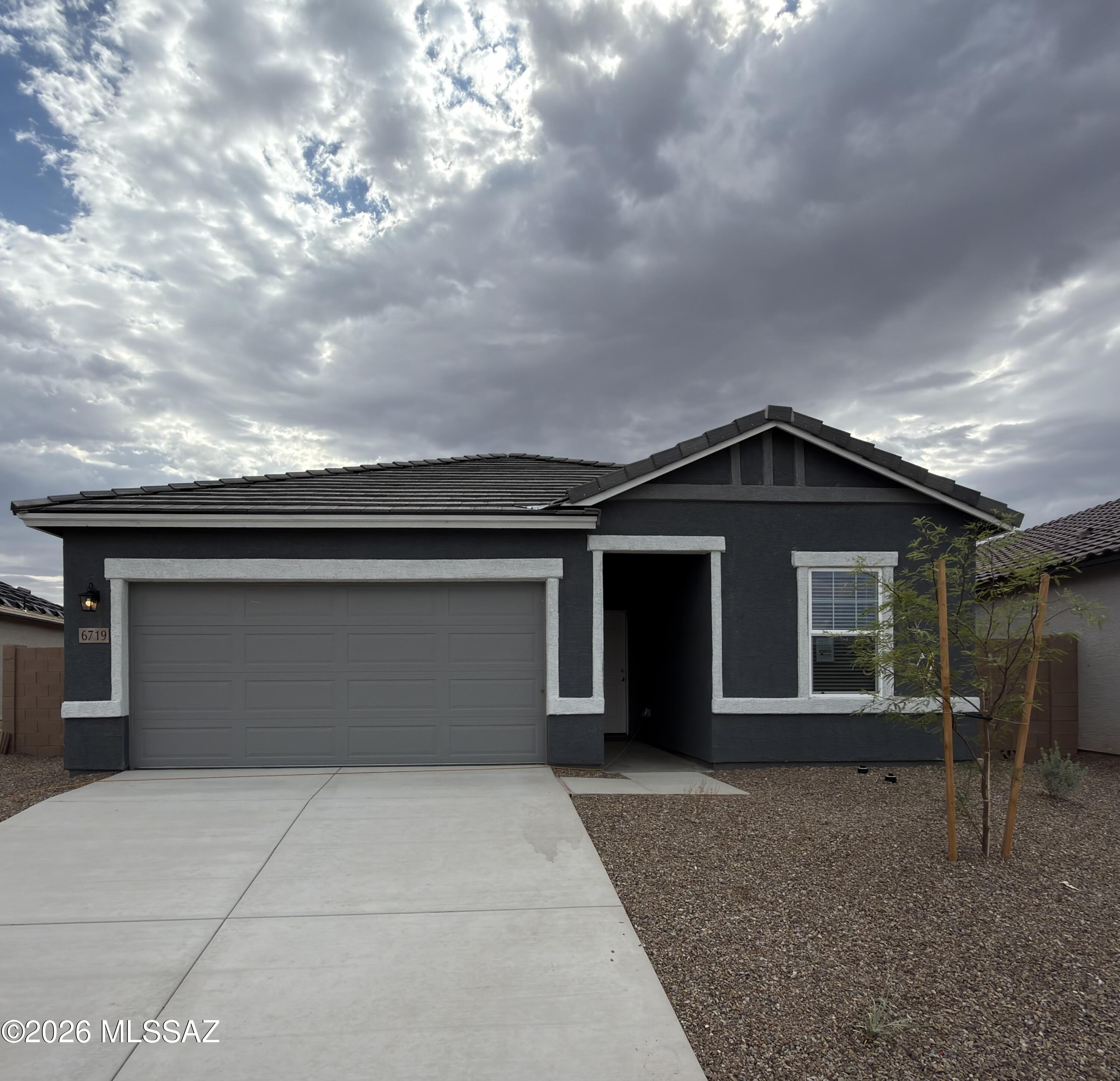 Our best-selling Prism plan sits right across from the park area with great views and beautiful sunsets!  4 Bedrooms and 3 Baths make this home a charmer!  Large island in the kitchen and a Jack-and-Jill 3rd bathroom too!  Beautiful, brand-new homes featuring thoughtfully designed floorplans in the scenic Tucson community of Star Valley! Conveniently located with easy access to I-19 and major Tucson destinations, this community offers the perfect balance of comfort, convenience, and outdoor living. Homes showcase desirable upgrades including 9' ceilings, white shaker cabinets, Shaw 17'' x 17'' tile flooring, and granite kitchen countertops. Each home comes move-in ready with stainless steel kitchen appliances, including a refrigerator, washer, and dryer. Energy-efficient features include Low-E dual-pane windows and a Wi-Fi programmable thermostat to help maximize comfort and savings. Exterior highlights include front yard desert landscaping with irrigation, covered patios, and spacious backyards designed for enjoying Tucson's beautiful sunsets. Residents enjoy community amenities including large park with soccer fields; walking paths and natural trails; children's play area; basketball courts; tennis courts; pickleball courts; natural-area dog park and incredible mountain views everywhere! This welcoming community offers the perfect combination of modern living and the natural beauty of the Tucson desert.