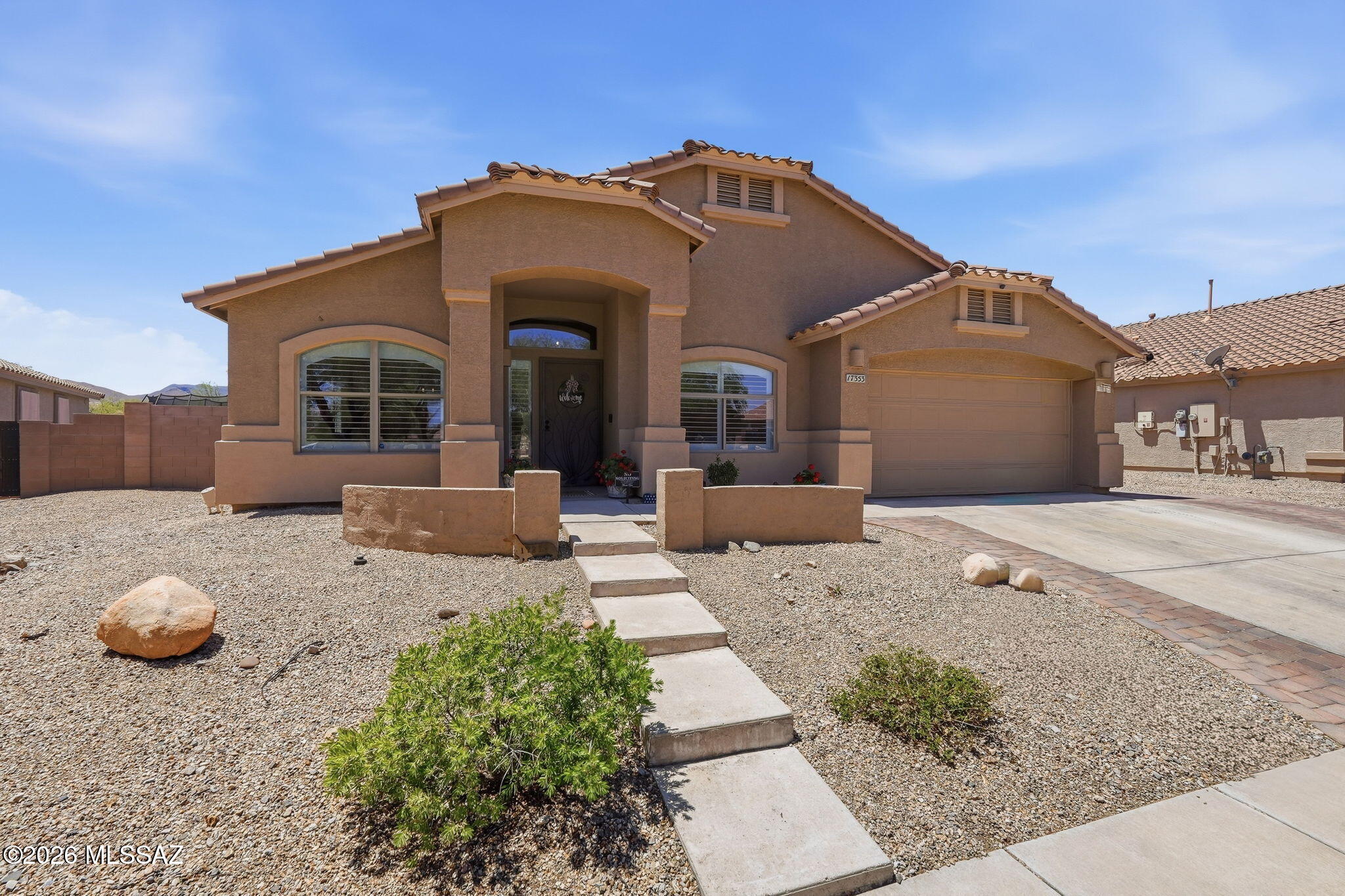 Sycamore Canyon home offers 4 BR(one has dual access & used as an office) updated kitchen (cabinets/quartz counters/black stainless steel appliances)& updated bathrooms! Kitchen has breakfast bar island & nook area for a table! Spacious walk-in pantry for all of the Costco finds! 2 areas for the family to relax: formal living room/dining room area or the family room off the kitchen area. Ceiling fans, Plantation shutters & luxury laminate flooring throughout (carpet in bedrooms). Primary BR has vaulted ceilings/patio access/ walk-in closet off of ensuite. Spa-like ensuite has free-standing tub, corner/glass shower (w/custom tile), dual sink vanity & tile floors. Backyard offers trees for shade, view fencing to take in the desert wildlife, turf & brick pavers for extra patio options.