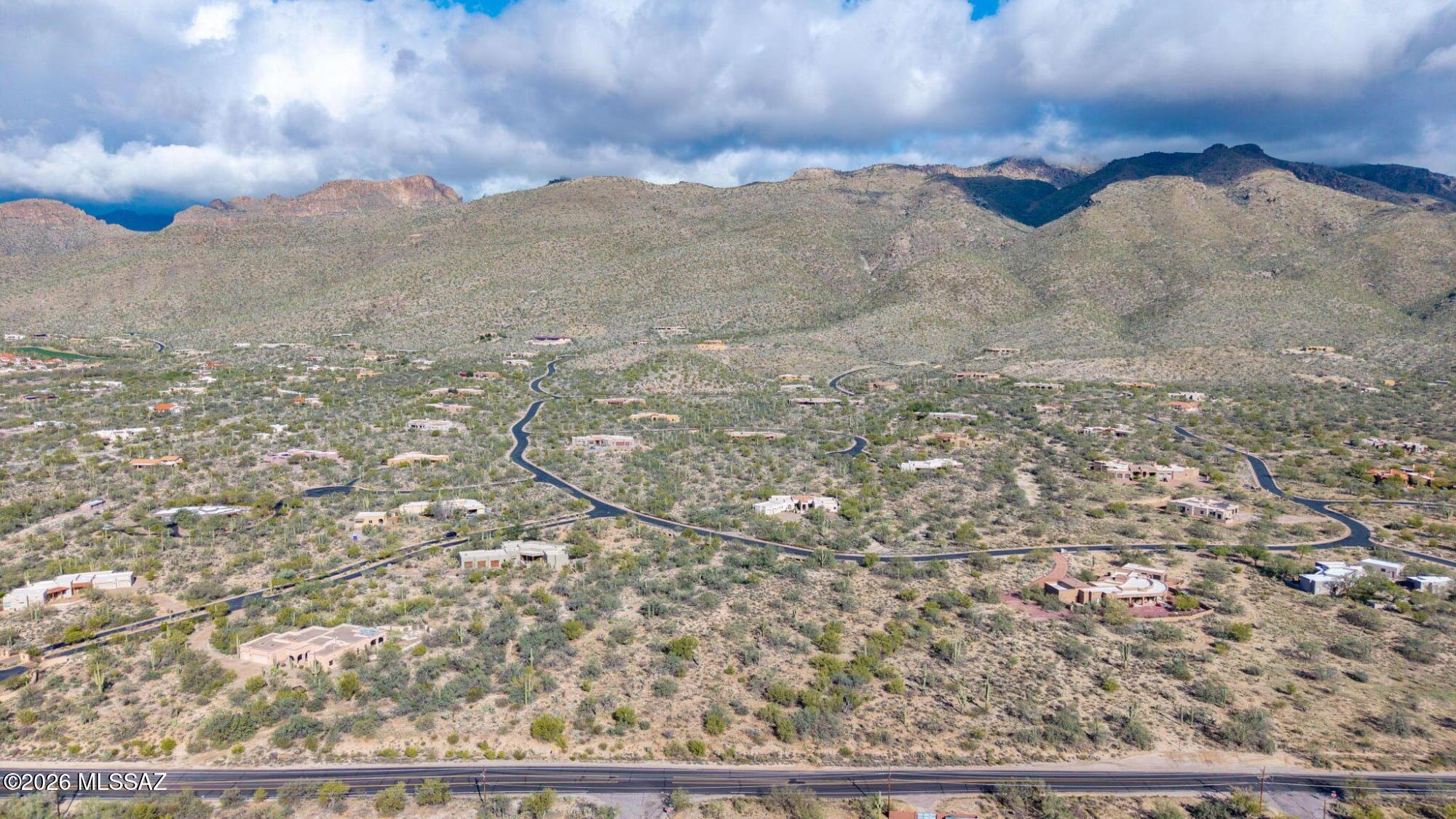A Must See! REALLY! Outstanding 3.4 acre site with impressive desert vegetation and fabulous views. Known as one of Tanque Verde's FINEST SUBDIVISIONS, gated Saguaro Hills Estates features million $+ CUSTOM HOMES of 60 lots, w/ quality road and environmental AMENITIES. LARGE, FLAT, low-prep building site with stunning city and mountain views. Utilities to line INCLUDING SEWER! Breathtaking views of LANDMARK PEAKS in north Catalina Mtns. Award-winning Tanque Verde schools. Floodplain site would use minimal 2' elevated pad to feature GLOW OF VALLEY LIGHTS. Prior seller had county approved plans for 4,000 sf home and 2,200 sf garage; see County records. Minimum 3,000 sf home, per HOA. During initial design planning, seller saw and bought home with similar design in this subdivision