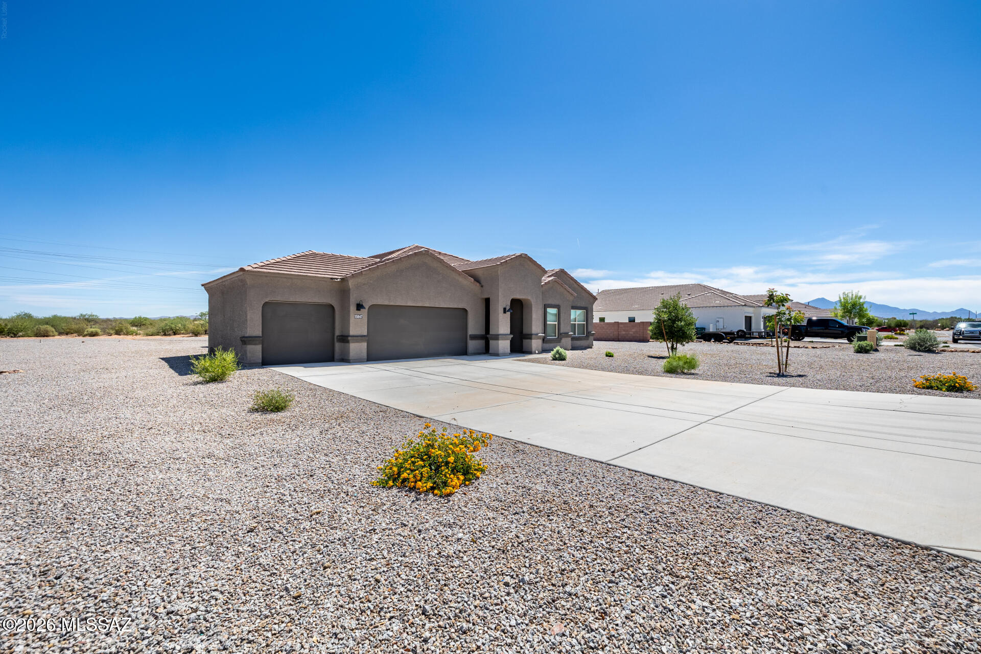 Charming single-story home with beautiful mountain views! Offering 4 bedrooms, 2 bathrooms & a 3-car garage. Inside, you'll find an inviting great room filled with natural light, showcasing wood-look flooring, recessed lighting, and neutral paint that works great with any choice of decor. The open-concept kitchen comes equipped with white shaker cabinets adorned with crown molding, tile backsplash, quartz countertops, stainless steel appliances, and an island, perfect for casual meals. The bedrooms boast soft carpeting, with the main suite offering a sizable walk-in closet and a bathroom with dual sinks. The expansive backyard hosts a cozy covered patio ideal for morning coffee and plenty of space for outdoor fun and your projects, ready for your personal touch! Hurry up and check it out!