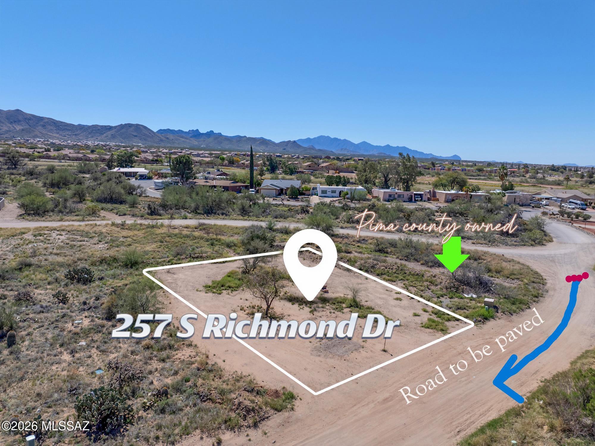 Live in the peaceful and serene area of Corona De Tucson.  Contemporary Santa Fe style!  With a paved street and huge extra fenced yard you have more than enough room for pool or toys! Built strong to beat the heat with 2x6 construction and spray foam insulation. This home is scheduled to finish in Fall 2026.  Kitchen will be fully equipped with stainless steel appliances suite, an oversized island with seating and pantry.   Washer/dryer included. Granite tops on all countertops.  Wood plank tile floors in all main living areas.  Rustic metal fence with double gate for cars, included.