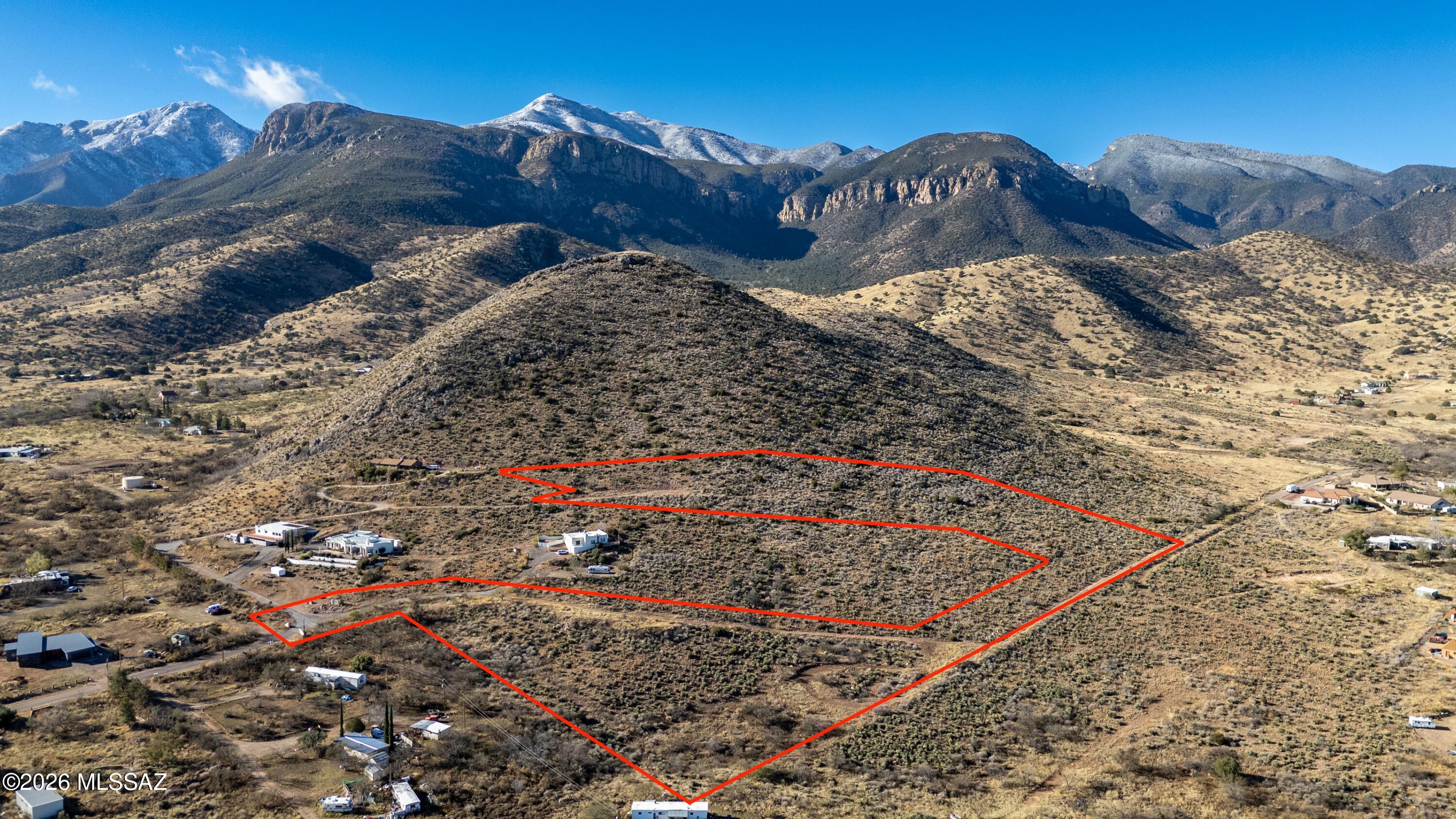 Discover a rare opportunity just South of Sierra Vista, this 9.42-acre parcel located at the end of a paved road and offering expansive valley views. The property is surveyed and approved to be split into up to four parcels, allowing you to purchase the full acreage or a smaller portion. Protective building guidelines apply, including western-style architecture, site-built homes only, and a minimum of 1,800 sq ft of living space (garage excluded). Perc tests have passed in two separate areas, power is at the lot line, and Liberty Water Company service is available, eliminating the need for a well. Underground utilities, a cleared easement off Kiefer Trail to the upper portion, and a location outside the flood zone add to the appeal. Ideal for a private estate or future development.