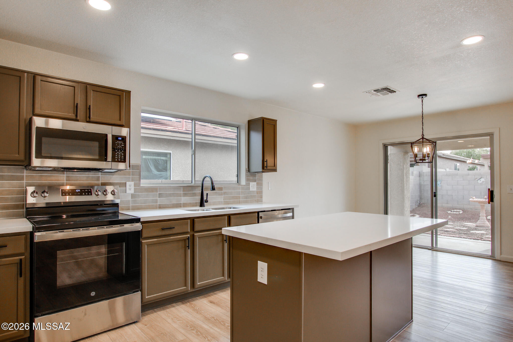 Now available!  Updated home in Harrison Terrace neighborhood. Beautiful features include luxury plank flooring, fresh interior paint, stainless steel appliances, Quartz countertops, neutral brown cabinets, earth tone backsplash and plush carpet in bedrooms. Fresh exterior paint. Large backyard with lots of possibilities.  A must see!